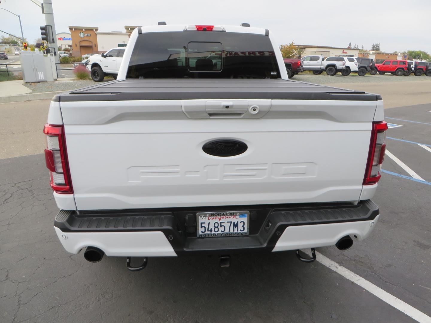 2022 White /black Ford F-150 Tremor SuperCrew 5.5-ft. Bed 4WD (1FTEW1E82NF) with an 3.5L V6 TURBO engine, 10 speed transmission, located at 2630 Grass Valley Highway, Auburn, CA, 95603, (530) 508-5100, 38.937893, -121.095482 - Tremor F150 Featuring an Icon Vehicle Dynamics stage 4 suspension system, 17" Method NV doubl eblack wheels, Nitto Ridge Grappler tires, Bakflip MX4, window tint, and custom paint to eliminate the Tremor orange and blue Ford emblems. - Photo#5