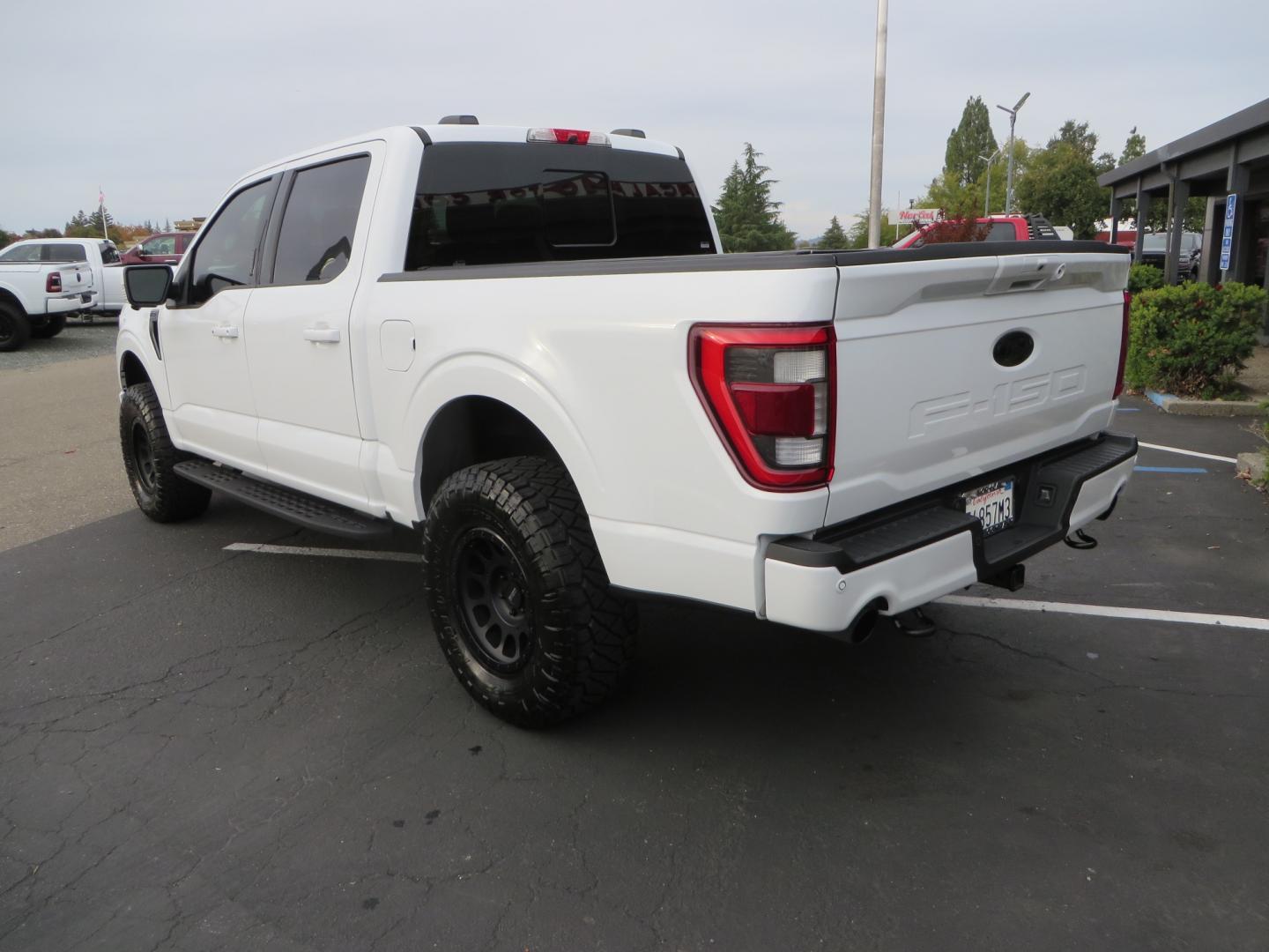 2022 White /black Ford F-150 Tremor SuperCrew 5.5-ft. Bed 4WD (1FTEW1E82NF) with an 3.5L V6 TURBO engine, 10 speed transmission, located at 2630 Grass Valley Highway, Auburn, CA, 95603, (530) 508-5100, 38.937893, -121.095482 - Tremor F150 Featuring an Icon Vehicle Dynamics stage 4 suspension system, 17" Method NV doubl eblack wheels, Nitto Ridge Grappler tires, Bakflip MX4, window tint, and custom paint to eliminate the Tremor orange and blue Ford emblems. - Photo#6