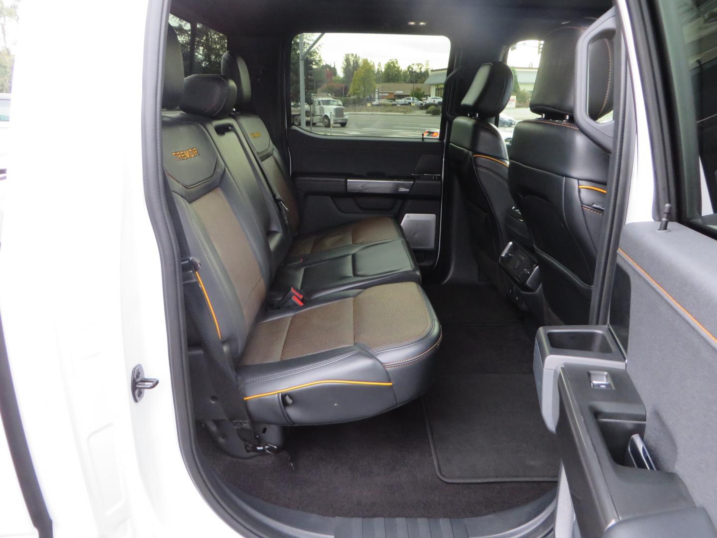 2022 White /black Ford F-150 Tremor SuperCrew 5.5-ft. Bed 4WD (1FTEW1E82NF) with an 3.5L V6 TURBO engine, 10 speed transmission, located at 2630 Grass Valley Highway, Auburn, CA, 95603, (530) 508-5100, 38.937893, -121.095482 - Tremor F150 Featuring an Icon Vehicle Dynamics stage 4 suspension system, 17" Method NV doubl eblack wheels, Nitto Ridge Grappler tires, Bakflip MX4, window tint, and custom paint to eliminate the Tremor orange and blue Ford emblems. - Photo#66