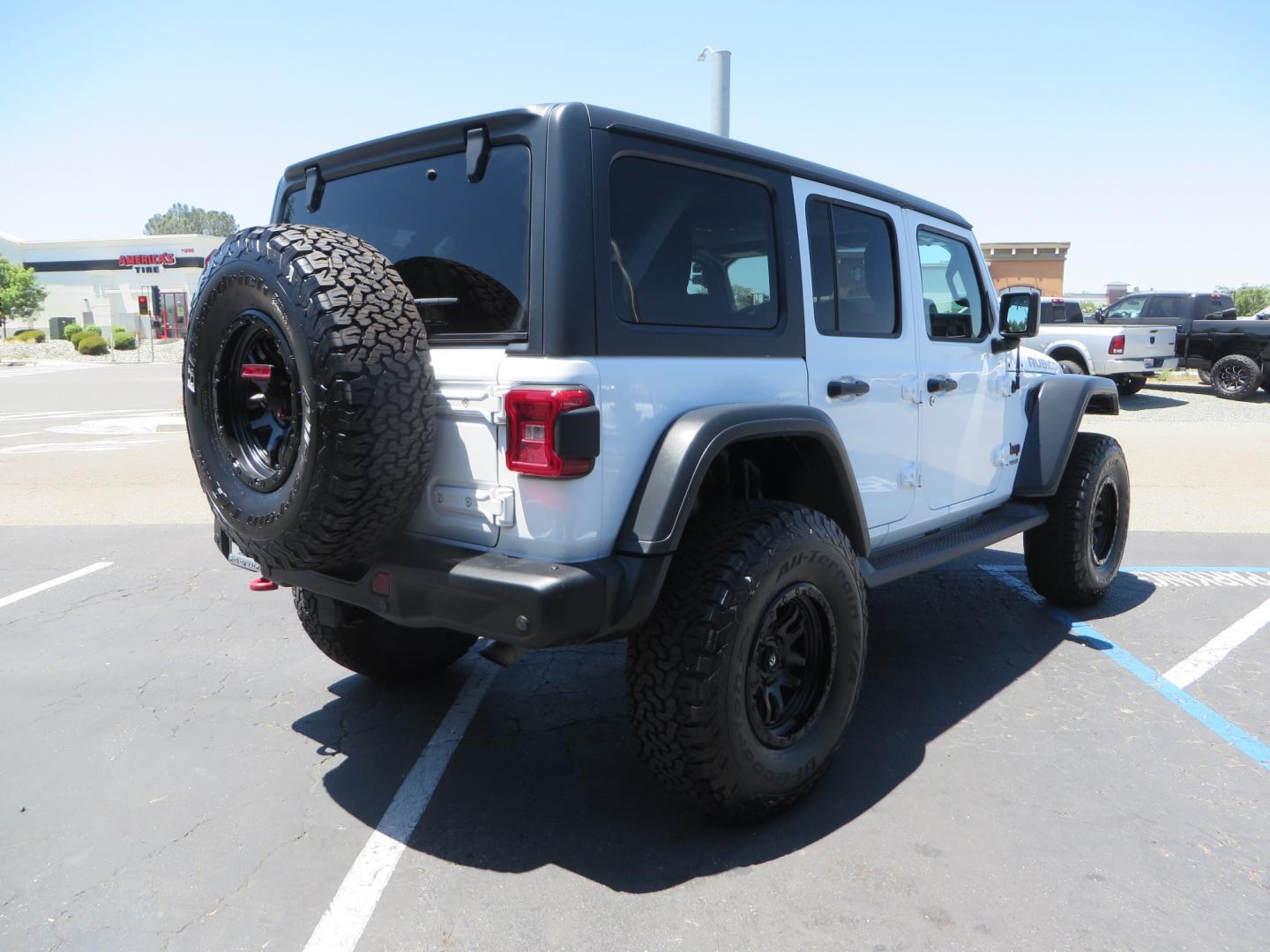 2018 White /black Jeep Wrangler JK Unlimited Rubicon 4WD (1C4HJXFGXJW) with an 3.6L V6 engine, Manual 6 speed transmission, located at 2630 Grass Valley Highway, Auburn, CA, 95603, (530) 508-5100, 38.937893, -121.095482 - Features - Zone Offroad 3" suspension system, Fox Adventure series shocks, 37" BFG KO2 tires, Fuel Ammo wheels, and a Teraflex spare tire relocation. - Photo#4