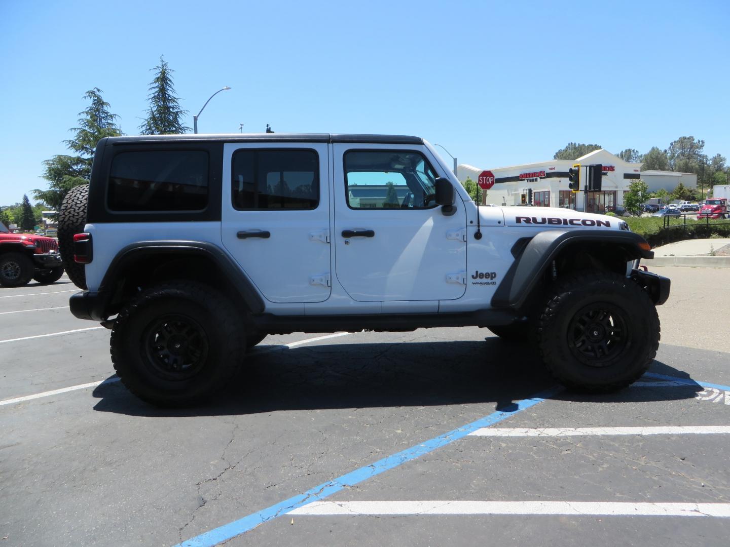 2018 White /black Jeep Wrangler JK Unlimited Rubicon 4WD (1C4HJXFGXJW) with an 3.6L V6 engine, Manual 6 speed transmission, located at 2630 Grass Valley Highway, Auburn, CA, 95603, (530) 508-5100, 38.937893, -121.095482 - Features - Zone Offroad 3" suspension system, Fox Adventure series shocks, 37" BFG KO2 tires, Fuel Ammo wheels, and a Teraflex spare tire relocation. - Photo#3