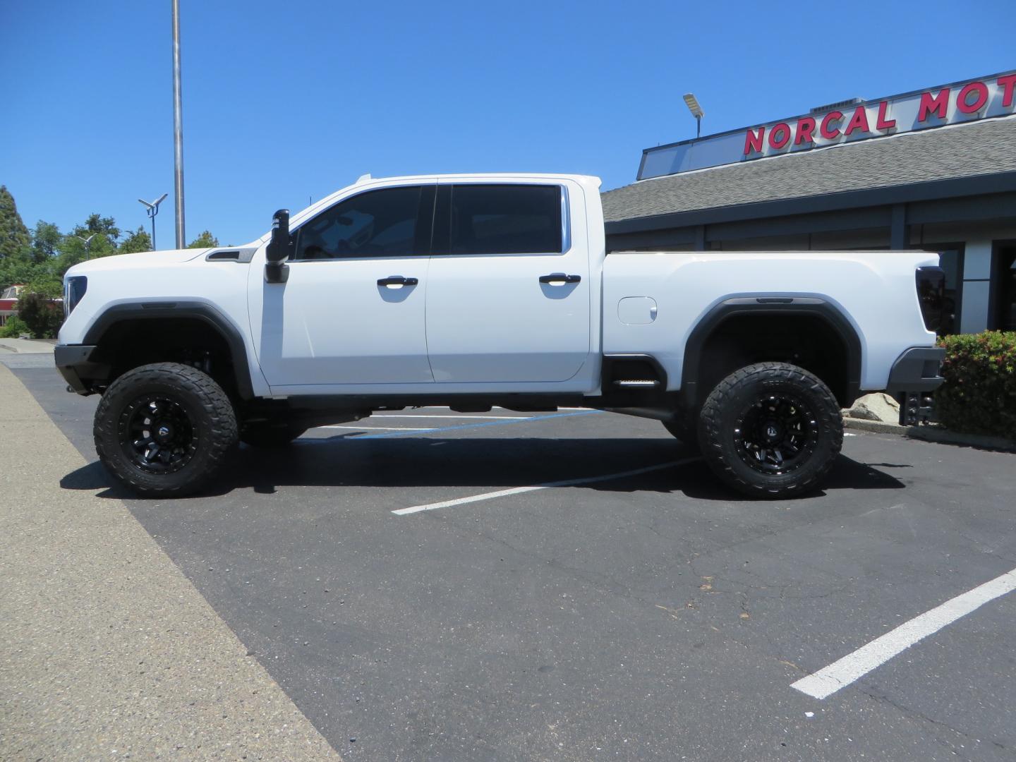 2021 White /black GMC Sierra 3500HD Denali (1GT49WEYXMF) with an 6.6L V8 TURBO DIESEL engine, automatic transmission, located at 2630 Grass Valley Highway, Auburn, CA, 95603, (530) 508-5100, 38.937893, -121.095482 - Must see Duramax with a ton of extras.... Cognito Suspension, Fox 2.0 remote reservoir shocks, 37" Nitto Recon Grappler tires, 20" Fuel Covert wheels, Sintor front and rear bumpers, Rigid LED lighting, Bakflip MX4, Gen Y hitch, Bolt locks, Amp Power steps, Window Tint, Sintor side badges, Smoked mar - Photo#7