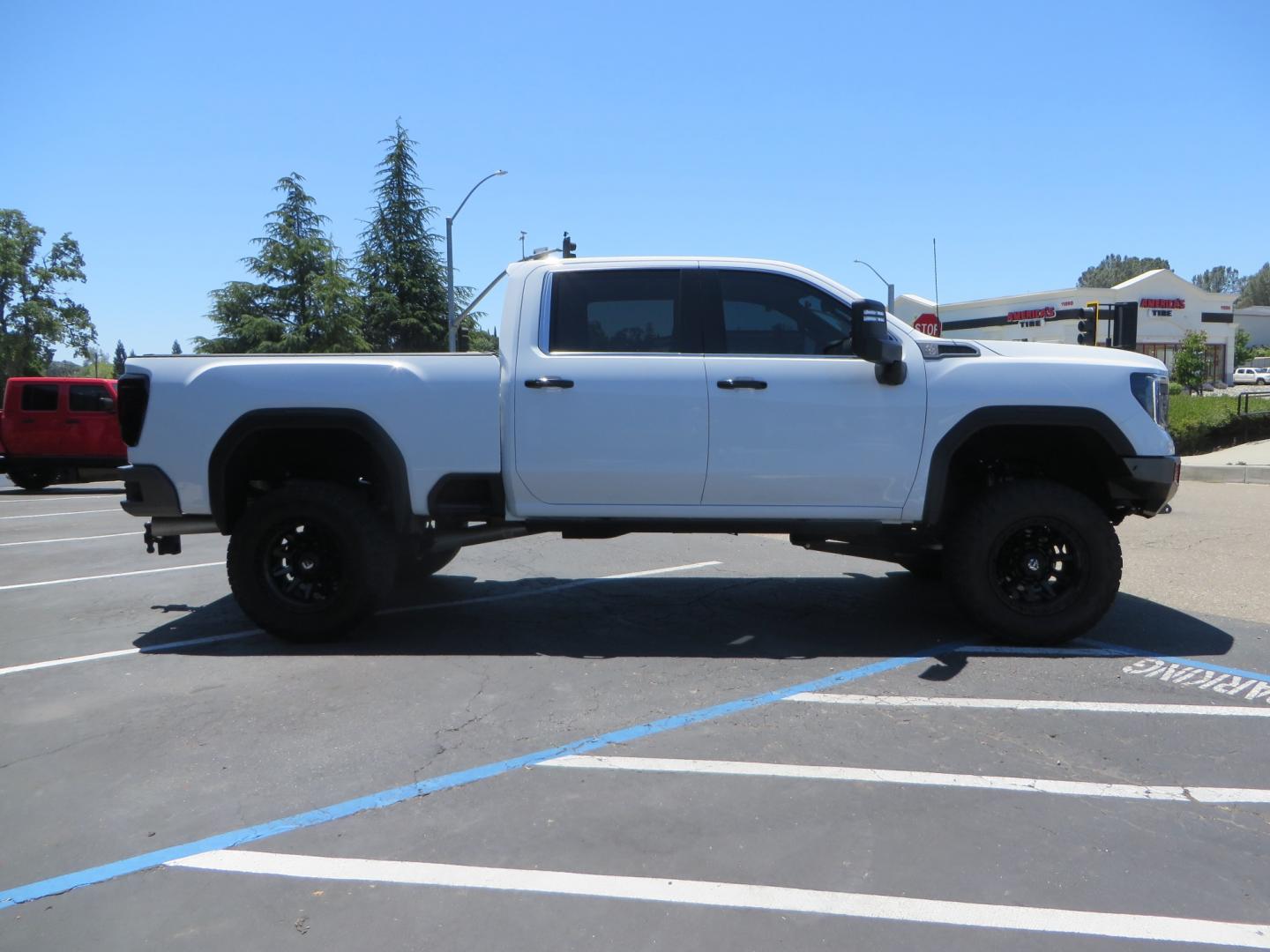 2021 White /black GMC Sierra 3500HD Denali (1GT49WEYXMF) with an 6.6L V8 TURBO DIESEL engine, automatic transmission, located at 2630 Grass Valley Highway, Auburn, CA, 95603, (530) 508-5100, 38.937893, -121.095482 - Must see Duramax with a ton of extras.... Cognito Suspension, Fox 2.0 remote reservoir shocks, 37" Nitto Recon Grappler tires, 20" Fuel Covert wheels, Sintor front and rear bumpers, Rigid LED lighting, Bakflip MX4, Gen Y hitch, Bolt locks, Amp Power steps, Window Tint, Sintor side badges, Smoked mar - Photo#3