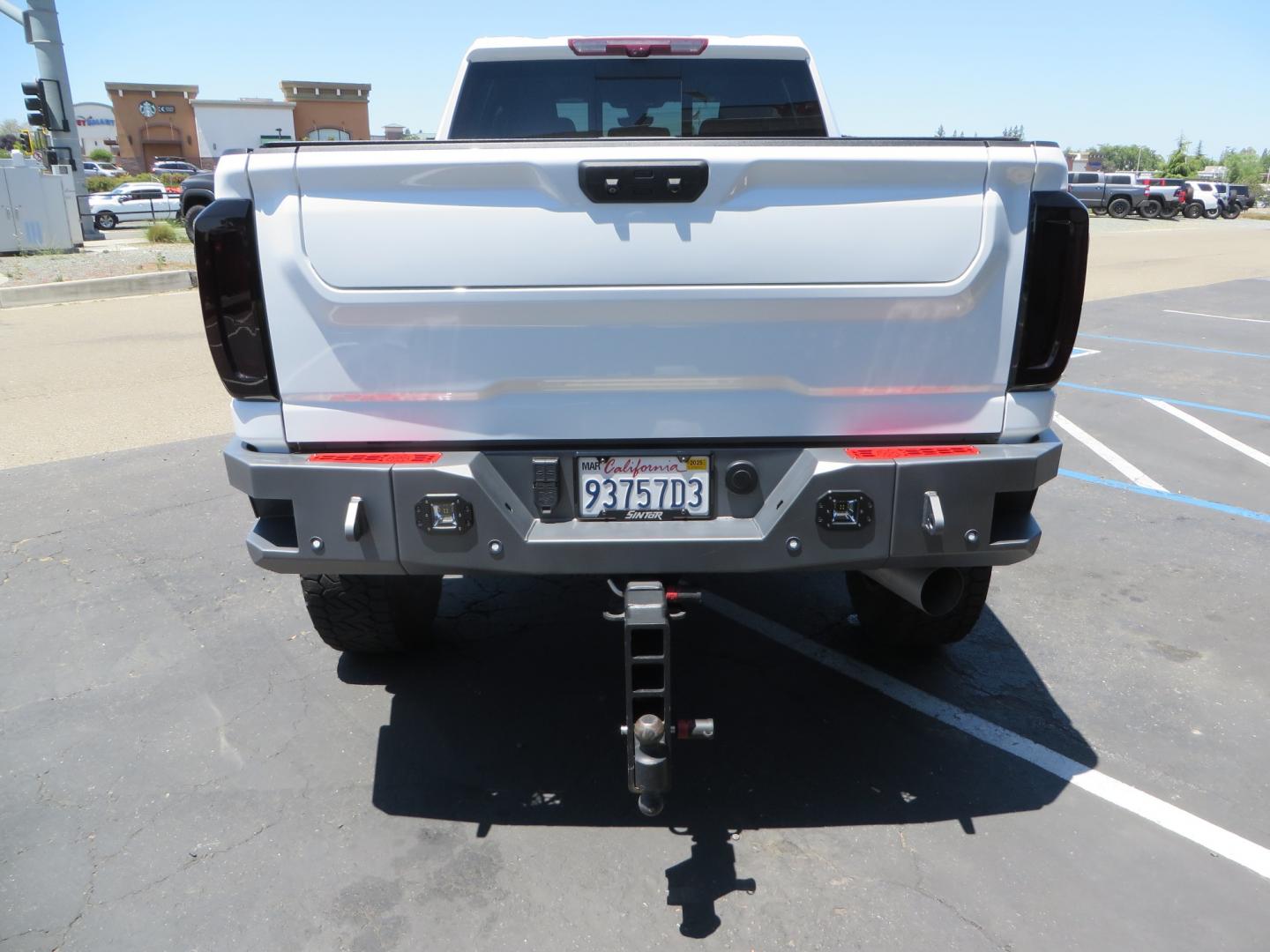 2021 White /black GMC Sierra 3500HD Denali (1GT49WEYXMF) with an 6.6L V8 TURBO DIESEL engine, automatic transmission, located at 2630 Grass Valley Highway, Auburn, CA, 95603, (530) 508-5100, 38.937893, -121.095482 - Must see Duramax with a ton of extras.... Cognito Suspension, Fox 2.0 remote reservoir shocks, 37" Nitto Recon Grappler tires, 20" Fuel Covert wheels, Sintor front and rear bumpers, Rigid LED lighting, Bakflip MX4, Gen Y hitch, Bolt locks, Amp Power steps, Window Tint, Sintor side badges, Smoked mar - Photo#5