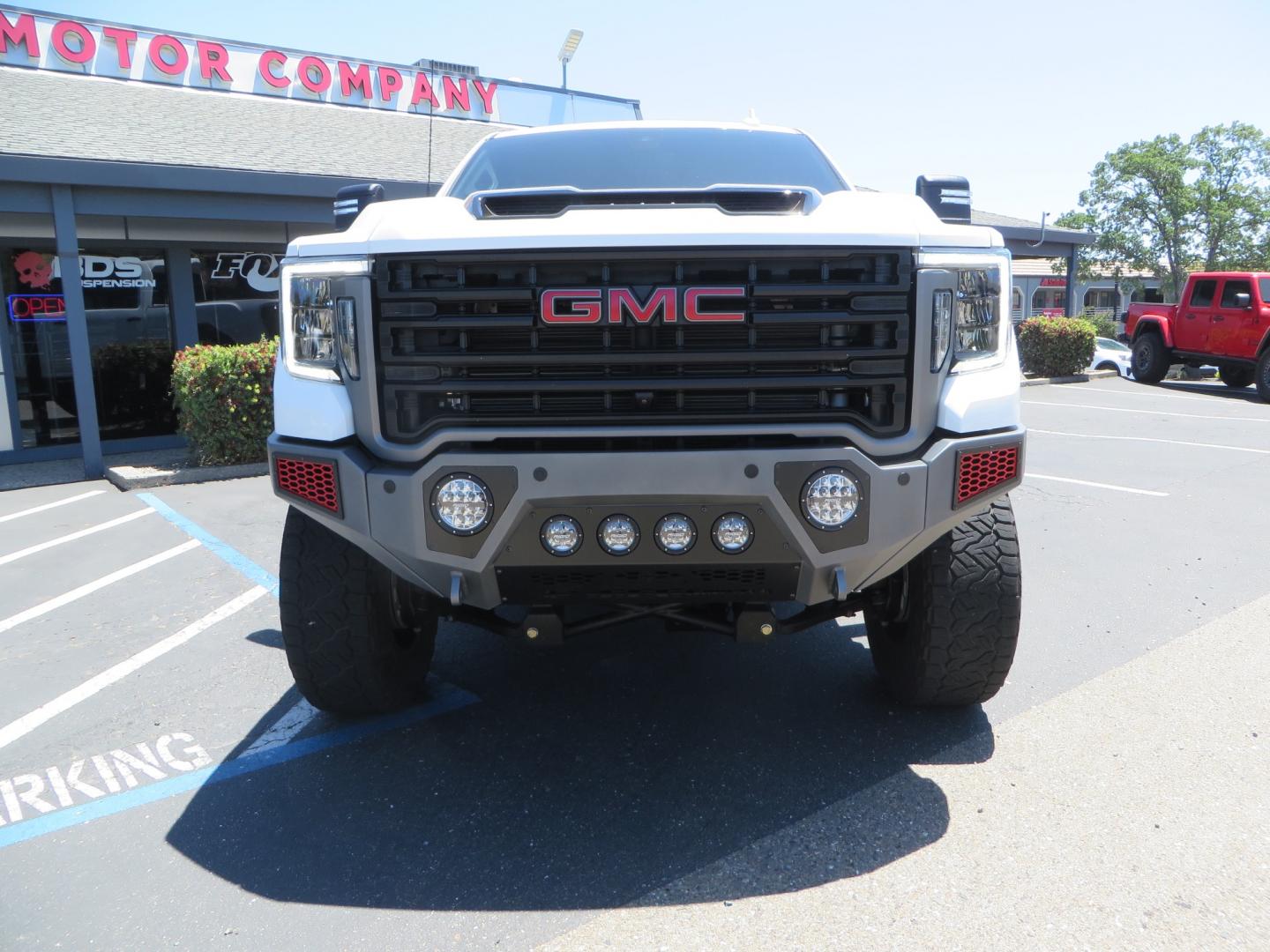 2021 White /black GMC Sierra 3500HD Denali (1GT49WEYXMF) with an 6.6L V8 TURBO DIESEL engine, automatic transmission, located at 2630 Grass Valley Highway, Auburn, CA, 95603, (530) 508-5100, 38.937893, -121.095482 - Must see Duramax with a ton of extras.... Cognito Suspension, Fox 2.0 remote reservoir shocks, 37" Nitto Recon Grappler tires, 20" Fuel Covert wheels, Sintor front and rear bumpers, Rigid LED lighting, Bakflip MX4, Gen Y hitch, Bolt locks, Amp Power steps, Window Tint, Sintor side badges, Smoked mar - Photo#1