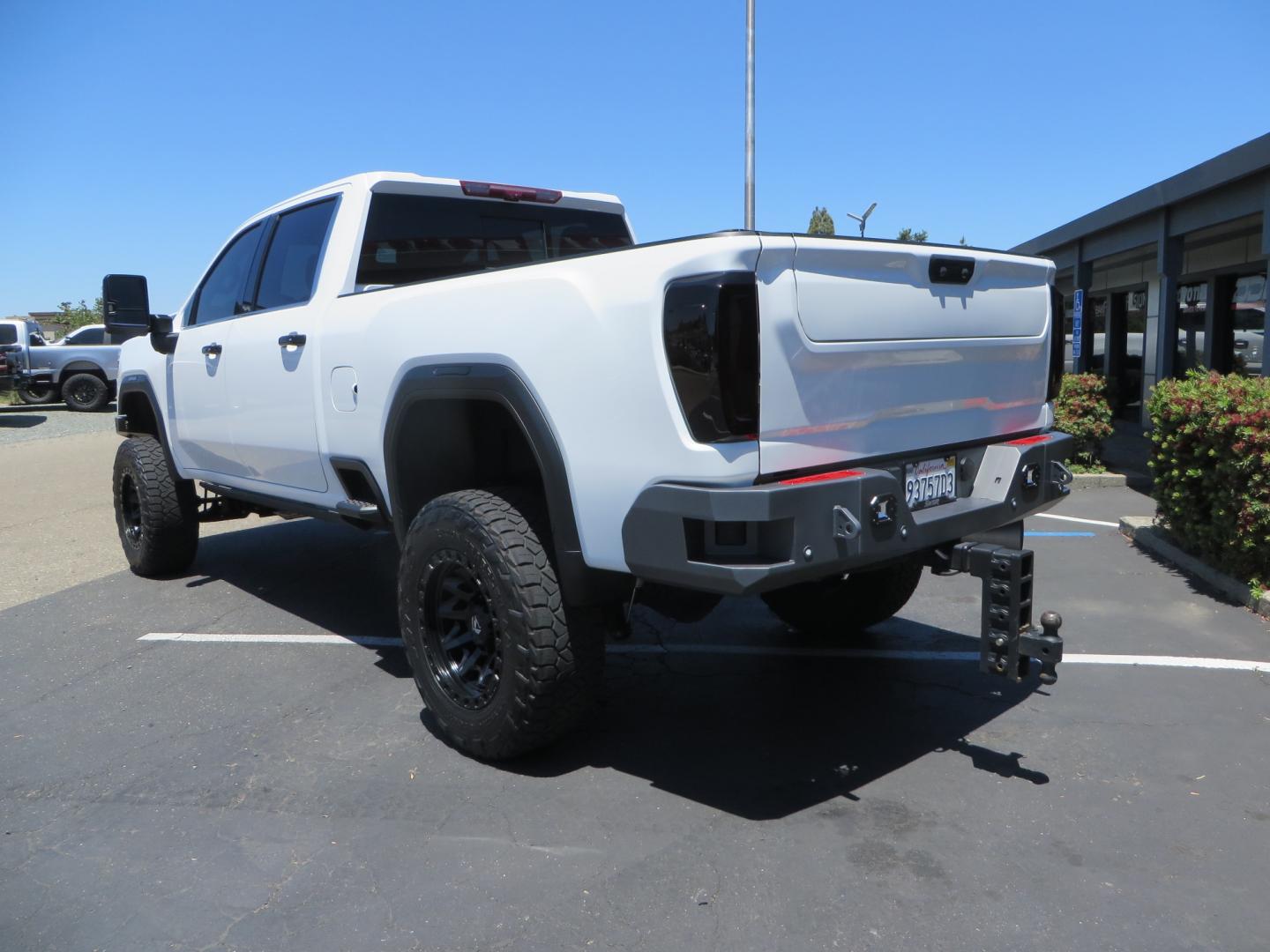 2021 White /black GMC Sierra 3500HD Denali (1GT49WEYXMF) with an 6.6L V8 TURBO DIESEL engine, automatic transmission, located at 2630 Grass Valley Highway, Auburn, CA, 95603, (530) 508-5100, 38.937893, -121.095482 - Must see Duramax with a ton of extras.... Cognito Suspension, Fox 2.0 remote reservoir shocks, 37" Nitto Recon Grappler tires, 20" Fuel Covert wheels, Sintor front and rear bumpers, Rigid LED lighting, Bakflip MX4, Gen Y hitch, Bolt locks, Amp Power steps, Window Tint, Sintor side badges, Smoked mar - Photo#6