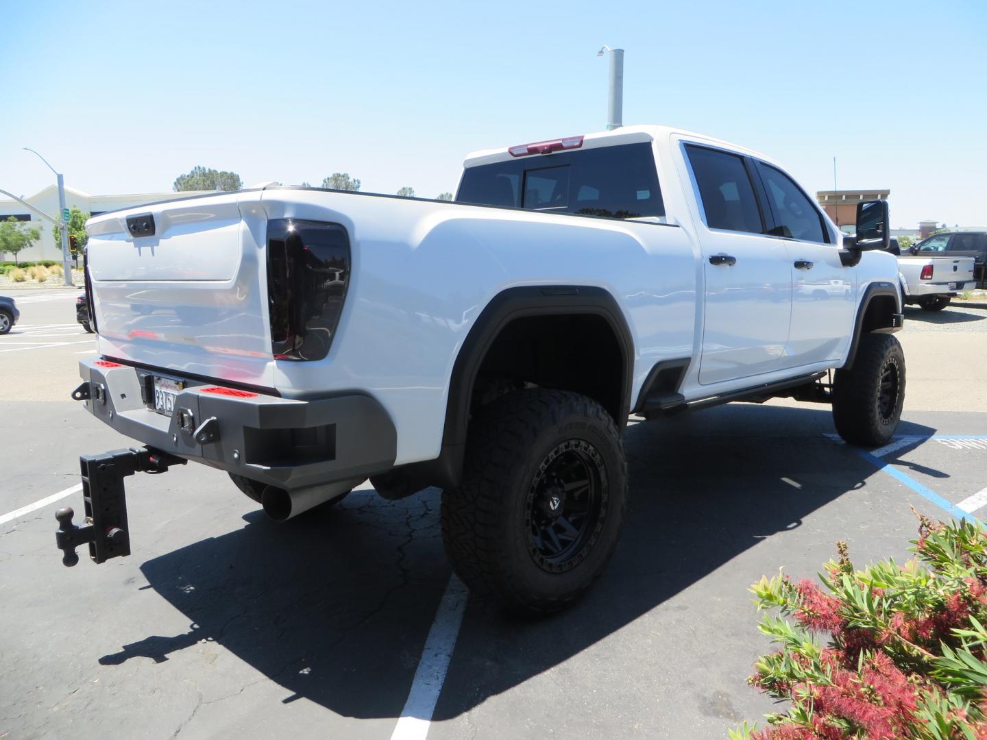 2021 White /black GMC Sierra 3500HD Denali (1GT49WEYXMF) with an 6.6L V8 TURBO DIESEL engine, automatic transmission, located at 2630 Grass Valley Highway, Auburn, CA, 95603, (530) 508-5100, 38.937893, -121.095482 - Must see Duramax with a ton of extras.... Cognito Suspension, Fox 2.0 remote reservoir shocks, 37" Nitto Recon Grappler tires, 20" Fuel Covert wheels, Sintor front and rear bumpers, Rigid LED lighting, Bakflip MX4, Gen Y hitch, Bolt locks, Amp Power steps, Window Tint, Sintor side badges, Smoked mar - Photo#4