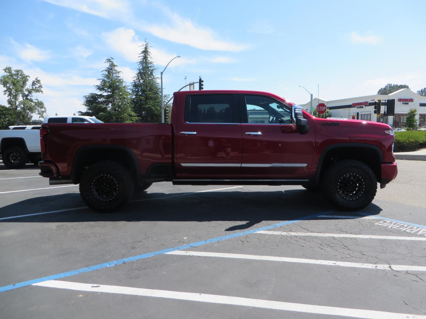 2024 MAROON /BLACK Chevrolet Silverado 2500HD High Country (1GC4YREY3RF) with an 6.6L V8 TURBO DIESEL engine, Automatic, 10-Spd transmission, located at 2630 Grass Valley Highway, Auburn, CA, 95603, (530) 508-5100, 38.937893, -121.095482 - Must see High Country Duramax with a Zone Offroad leveling kit, Fox 2.0 shocks, 17" Method MR315 wheels, and 35" Toyo RT trail tires. - Photo#3