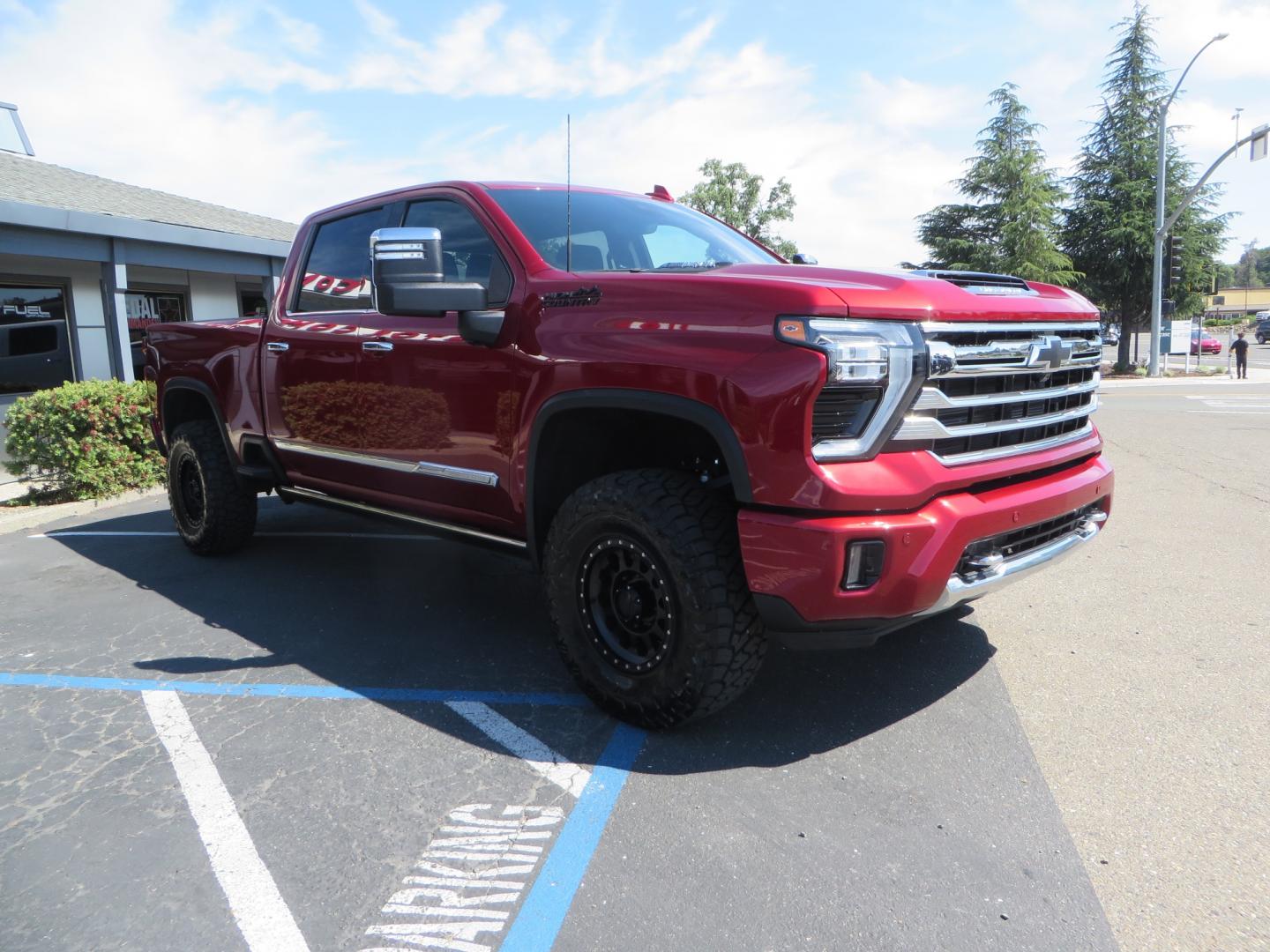 2024 MAROON /BLACK Chevrolet Silverado 2500HD High Country (1GC4YREY3RF) with an 6.6L V8 TURBO DIESEL engine, Automatic, 10-Spd transmission, located at 2630 Grass Valley Highway, Auburn, CA, 95603, (530) 508-5100, 38.937893, -121.095482 - Must see High Country Duramax with a Zone Offroad leveling kit, Fox 2.0 shocks, 17" Method MR315 wheels, and 35" Toyo RT trail tires. - Photo#2