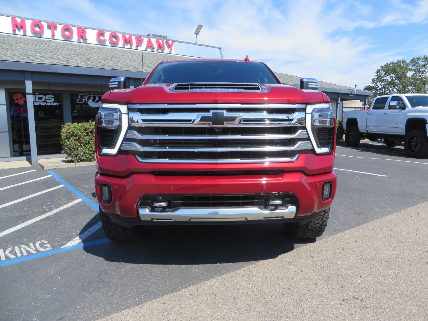 2024 MAROON /BLACK Chevrolet Silverado 2500HD High Country (1GC4YREY3RF) with an 6.6L V8 TURBO DIESEL engine, Automatic, 10-Spd transmission, located at 2630 Grass Valley Highway, Auburn, CA, 95603, (530) 508-5100, 38.937893, -121.095482 - Must see High Country Duramax with a Zone Offroad leveling kit, Fox 2.0 shocks, 17" Method MR315 wheels, and 35" Toyo RT trail tires. - Photo#1