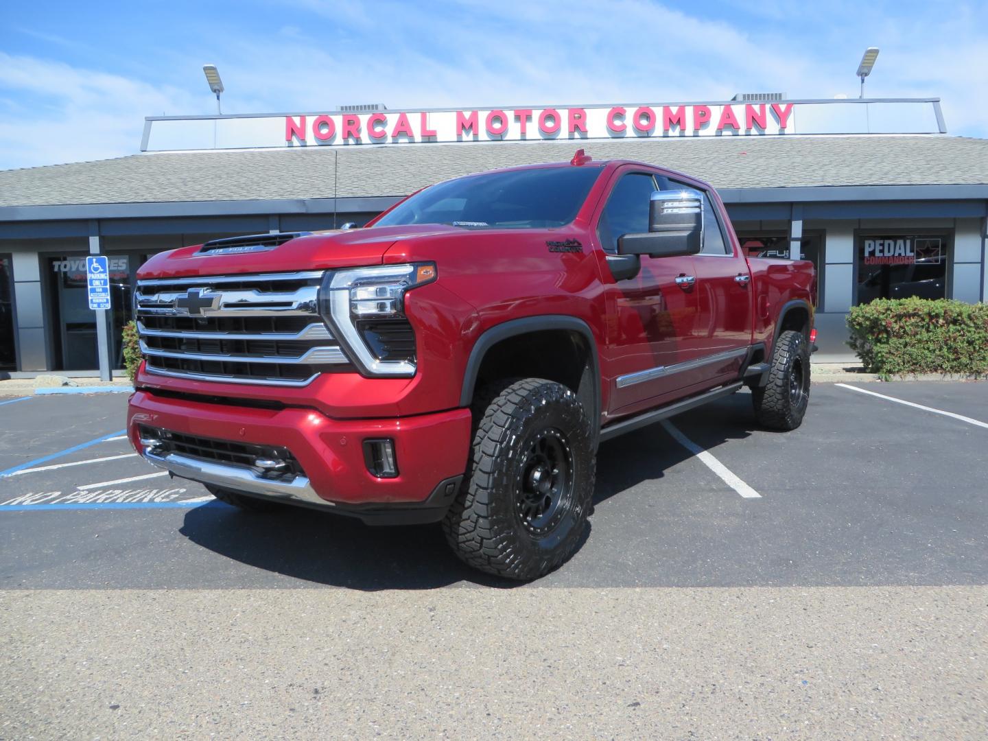 2024 MAROON /BLACK Chevrolet Silverado 2500HD High Country (1GC4YREY3RF) with an 6.6L V8 TURBO DIESEL engine, Automatic, 10-Spd transmission, located at 2630 Grass Valley Highway, Auburn, CA, 95603, (530) 508-5100, 38.937893, -121.095482 - Must see High Country Duramax with a Zone Offroad leveling kit, Fox 2.0 shocks, 17" Method MR315 wheels, and 35" Toyo RT trail tires. - Photo#0