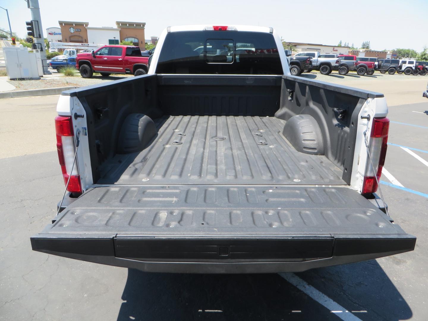 2018 White /BROWN Ford F-350 SD King Ranch Crew Cab 4WD (1FT8W3BT9JE) with an 6.7L V8 DIESEL engine, automatic transmission, located at 2630 Grass Valley Highway, Auburn, CA, 95603, (530) 508-5100, 38.937893, -121.095482 - Very clean King Ranch sitting on a level kit, 20" Gear wheels, and 35" Toyo AT3 tires. - Photo#10