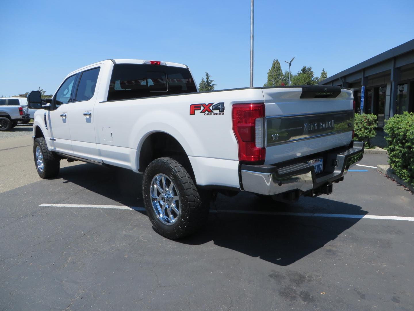 2018 White /BROWN Ford F-350 SD King Ranch Crew Cab 4WD (1FT8W3BT9JE) with an 6.7L V8 DIESEL engine, automatic transmission, located at 2630 Grass Valley Highway, Auburn, CA, 95603, (530) 508-5100, 38.937893, -121.095482 - Very clean King Ranch sitting on a level kit, 20" Gear wheels, and 35" Toyo AT3 tires. - Photo#6