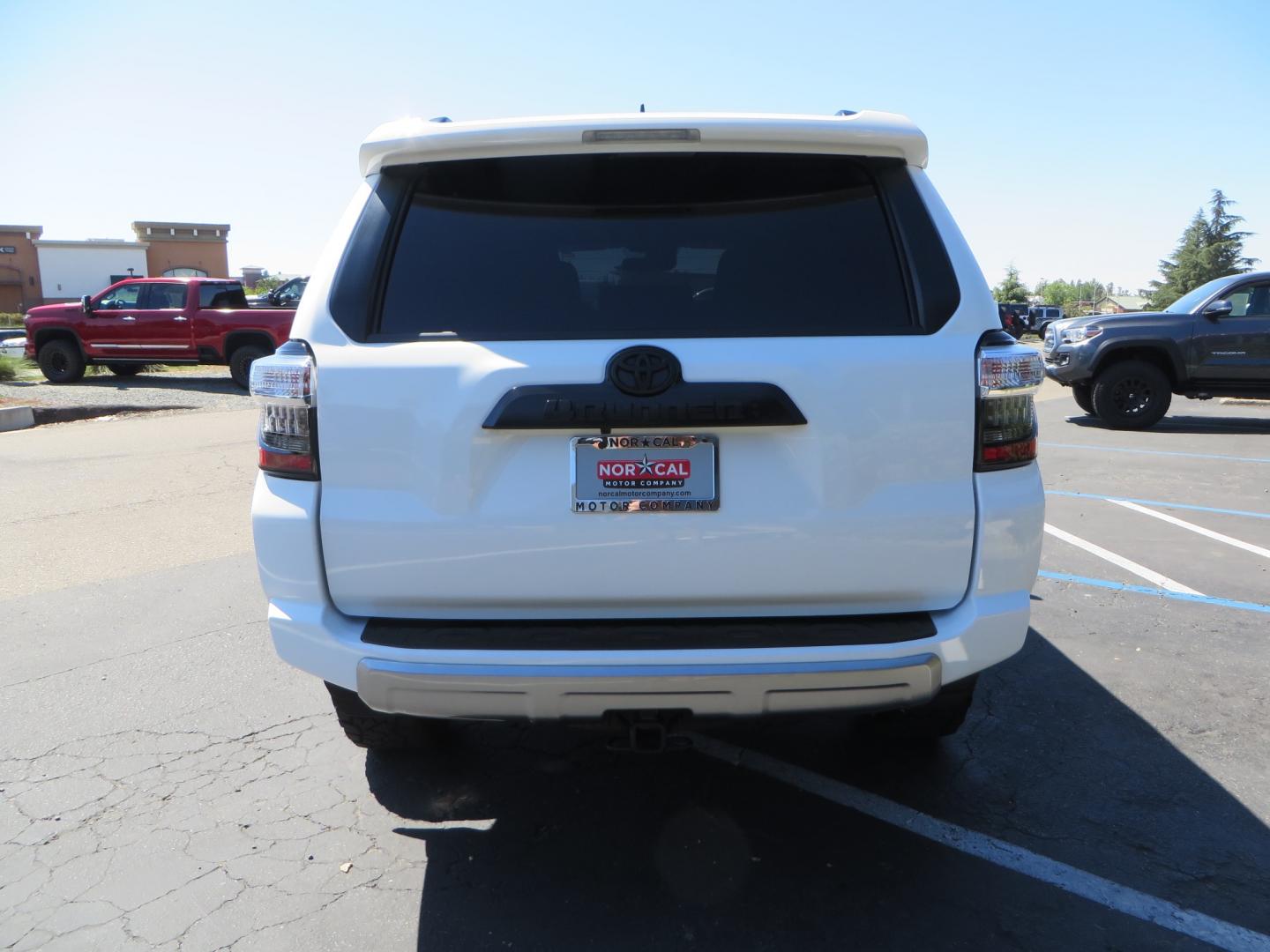 2021 White /Black Toyota 4Runner TRD Off-road Premium 4WD (JTERU5JR1M5) with an 4.0L V6 DOHC 24V engine, 5A transmission, located at 2630 Grass Valley Highway, Auburn, CA, 95603, (530) 508-5100, 38.937893, -121.095482 - TRD Off-Road with Bilstein 5100 series front struts, 17" Method race wheels, Toyo RT Trail tires, Window tint, and AVS window wind deflectors . - Photo#5