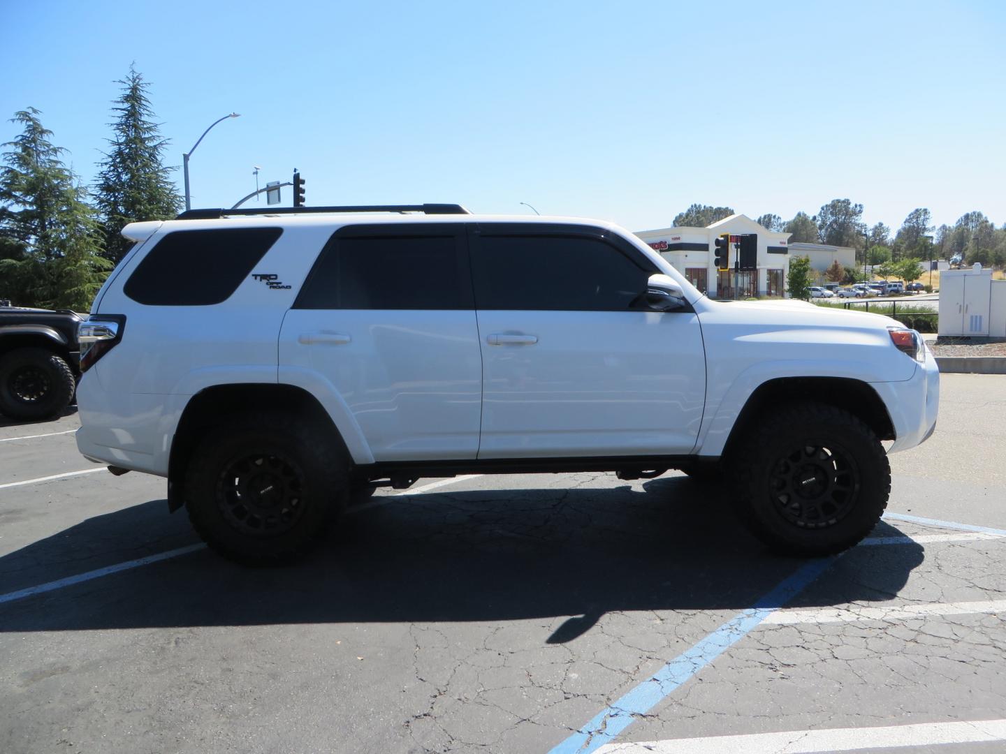 2021 White /Black Toyota 4Runner TRD Off-road Premium 4WD (JTERU5JR1M5) with an 4.0L V6 DOHC 24V engine, 5A transmission, located at 2630 Grass Valley Highway, Auburn, CA, 95603, (530) 508-5100, 38.937893, -121.095482 - TRD Off-Road with Bilstein 5100 series front struts, 17" Method race wheels, Toyo RT Trail tires, Window tint, and AVS window wind deflectors . - Photo#3