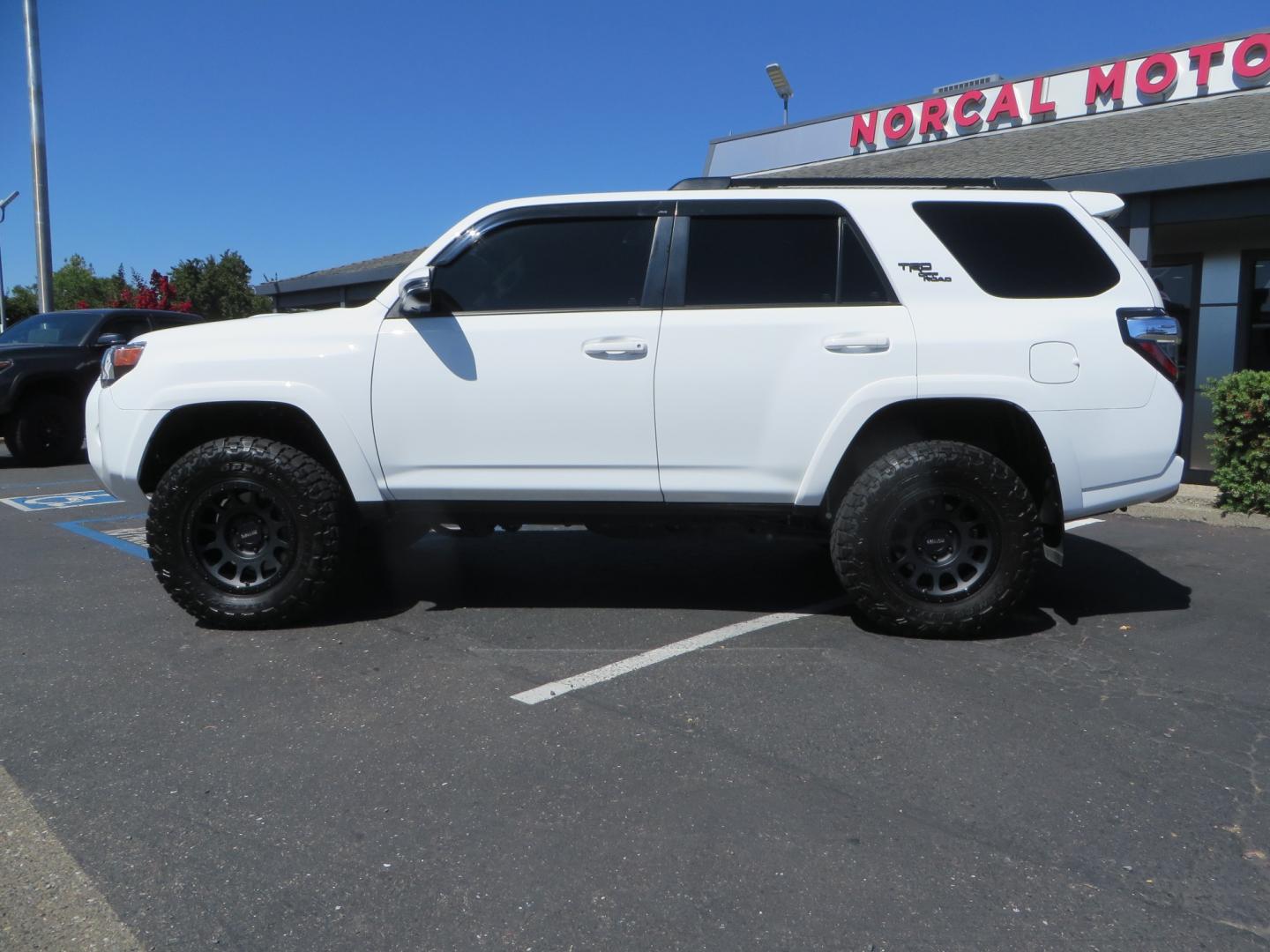 2021 White /Black Toyota 4Runner TRD Off-road Premium 4WD (JTERU5JR1M5) with an 4.0L V6 DOHC 24V engine, 5A transmission, located at 2630 Grass Valley Highway, Auburn, CA, 95603, (530) 508-5100, 38.937893, -121.095482 - TRD Off-Road with Bilstein 5100 series front struts, 17" Method race wheels, Toyo RT Trail tires, Window tint, and AVS window wind deflectors . - Photo#7