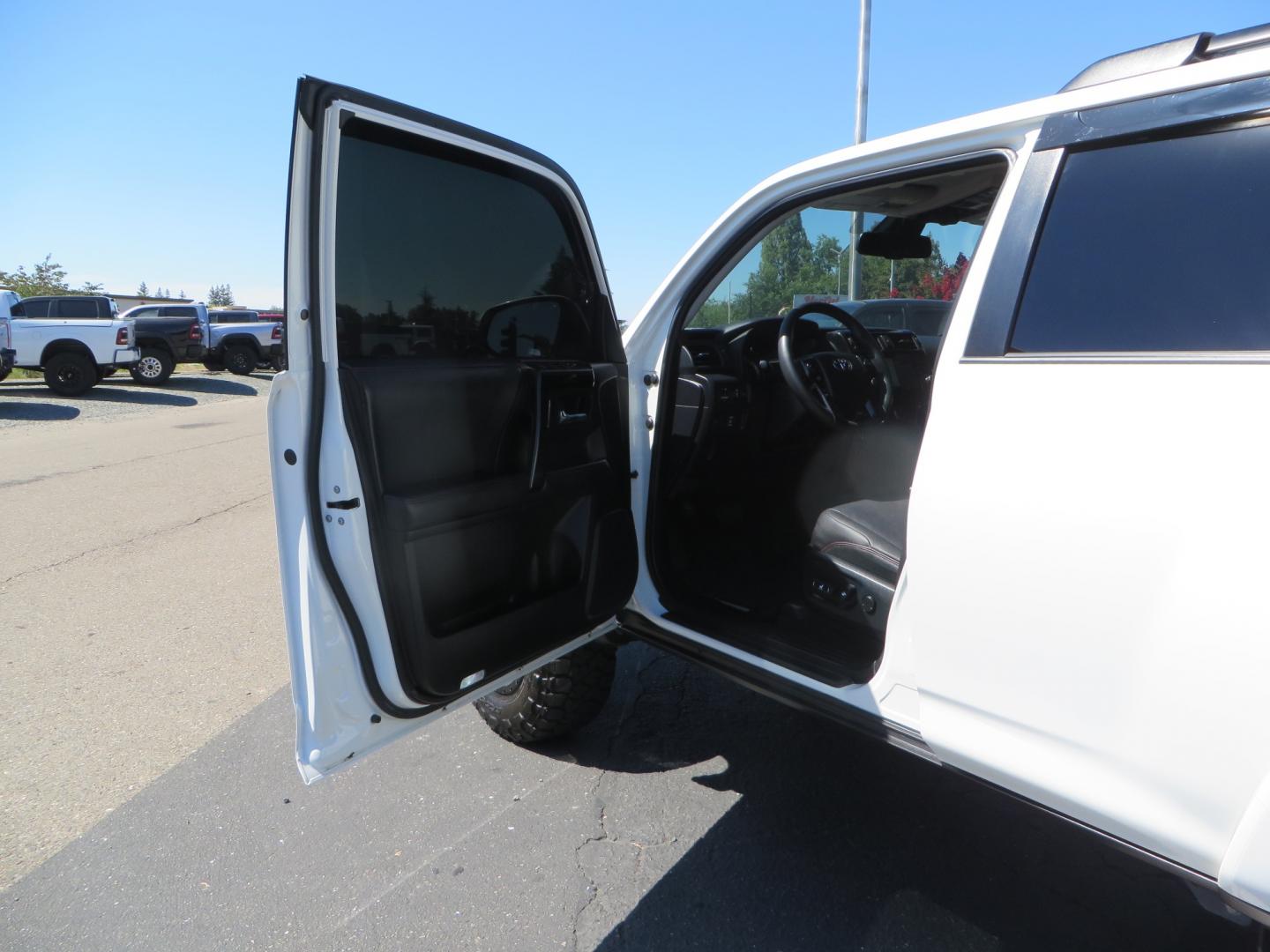 2021 White /Black Toyota 4Runner TRD Off-road Premium 4WD (JTERU5JR1M5) with an 4.0L V6 DOHC 24V engine, 5A transmission, located at 2630 Grass Valley Highway, Auburn, CA, 95603, (530) 508-5100, 38.937893, -121.095482 - TRD Off-Road with Bilstein 5100 series front struts, 17" Method race wheels, Toyo RT Trail tires, Window tint, and AVS window wind deflectors . - Photo#12