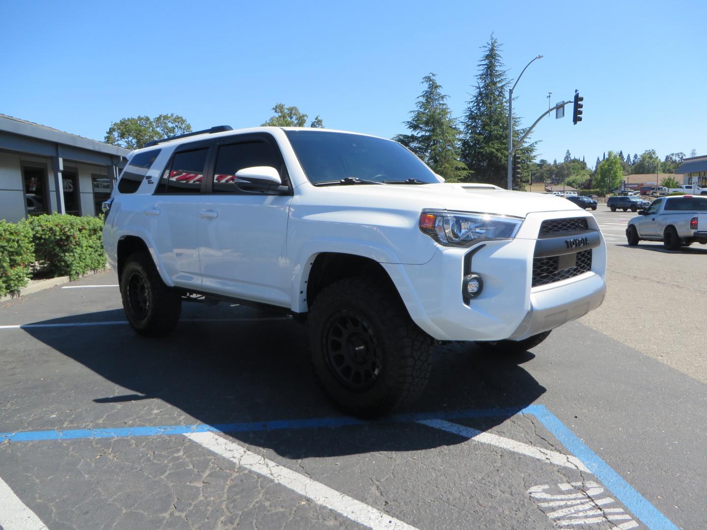 2021 White /Black Toyota 4Runner TRD Off-road Premium 4WD (JTERU5JR1M5) with an 4.0L V6 DOHC 24V engine, 5A transmission, located at 2630 Grass Valley Highway, Auburn, CA, 95603, (530) 508-5100, 38.937893, -121.095482 - TRD Off-Road with Bilstein 5100 series front struts, 17" Method race wheels, Toyo RT Trail tires, Window tint, and AVS window wind deflectors . - Photo#2