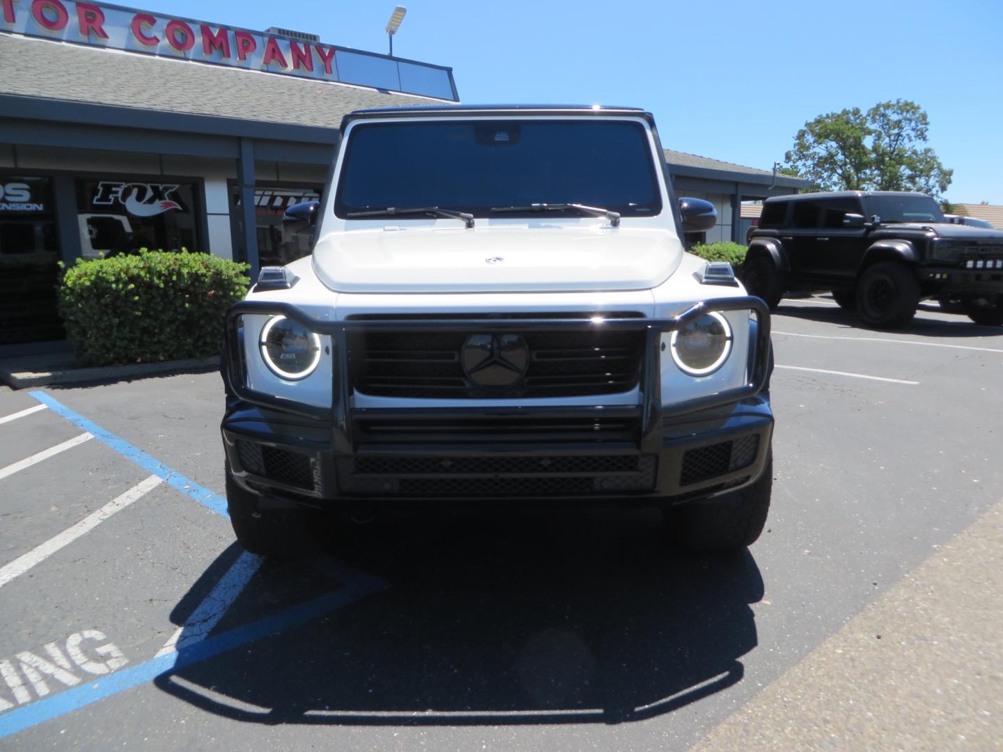 2021 White /Red Mercedes-Benz G-Class G 550 (W1NYC6BJ1MX) with an 4.0L V8 engine, automatic transmission, located at 2630 Grass Valley Highway, Auburn, CA, 95603, (530) 508-5100, 38.937893, -121.095482 - Features Vossen Wheels and Toyo AT3 tires. Also has the stock wheels and tires as well. - Photo#1