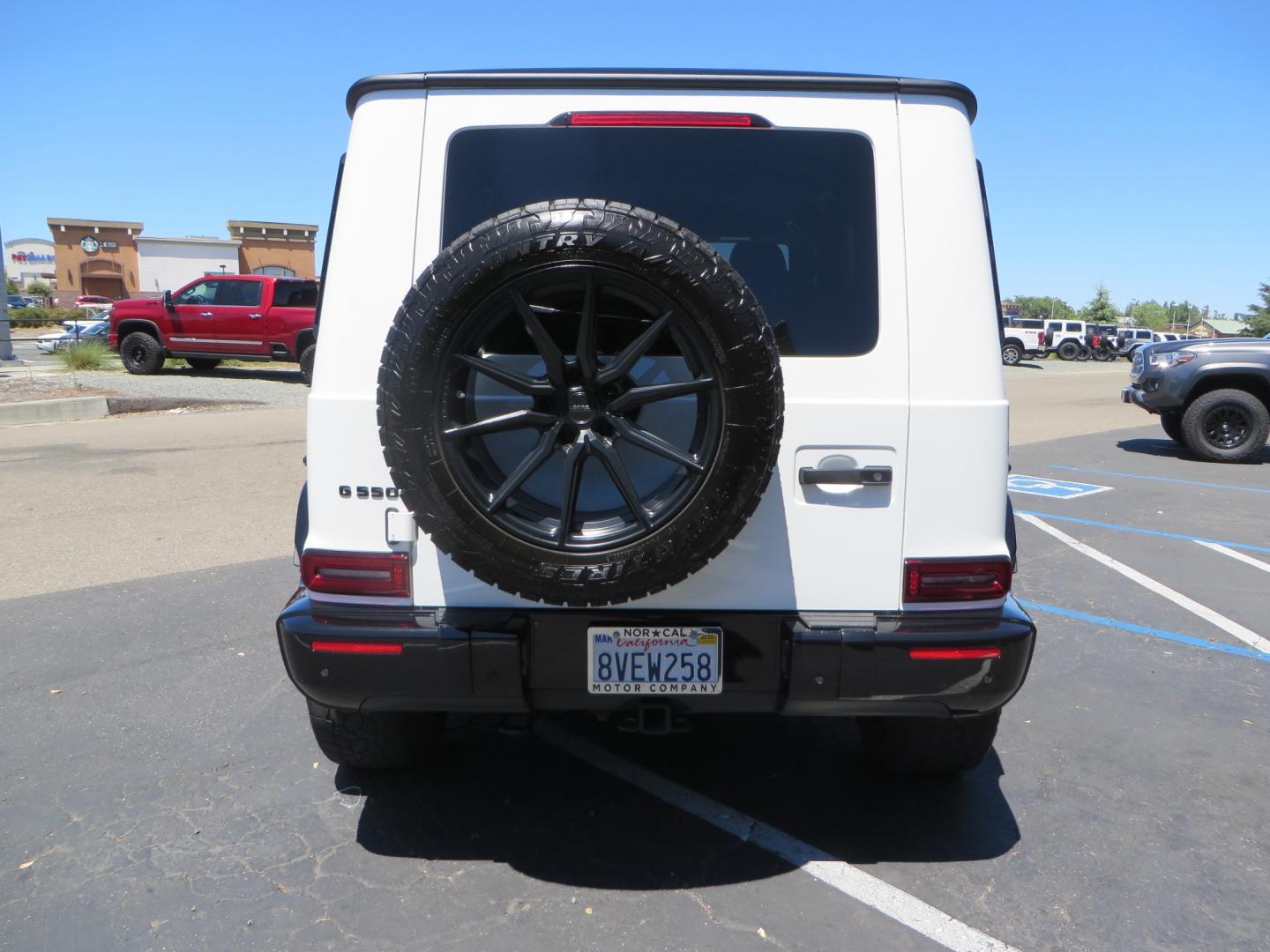 2021 White /Red Mercedes-Benz G-Class G 550 (W1NYC6BJ1MX) with an 4.0L V8 engine, automatic transmission, located at 2630 Grass Valley Highway, Auburn, CA, 95603, (530) 508-5100, 38.937893, -121.095482 - Features Vossen Wheels and Toyo AT3 tires. Also has the stock wheels and tires as well. - Photo#5