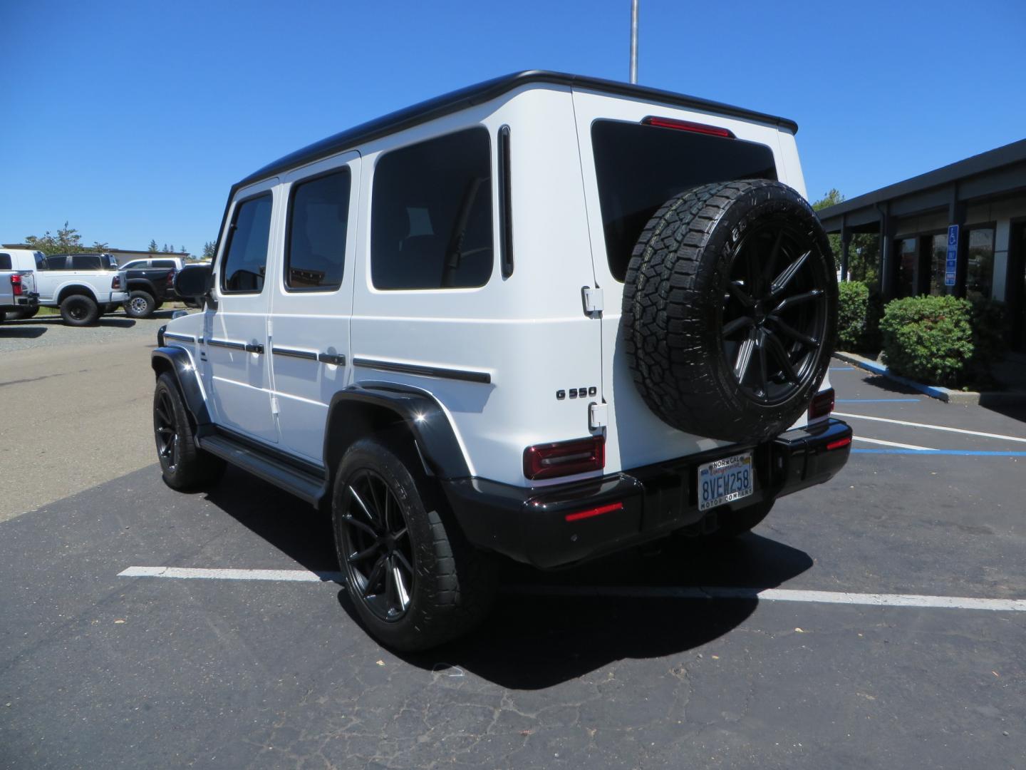 2021 White /Red Mercedes-Benz G-Class G 550 (W1NYC6BJ1MX) with an 4.0L V8 engine, automatic transmission, located at 2630 Grass Valley Highway, Auburn, CA, 95603, (530) 508-5100, 38.937893, -121.095482 - Features Vossen Wheels and Toyo AT3 tires. Also has the stock wheels and tires as well. - Photo#6