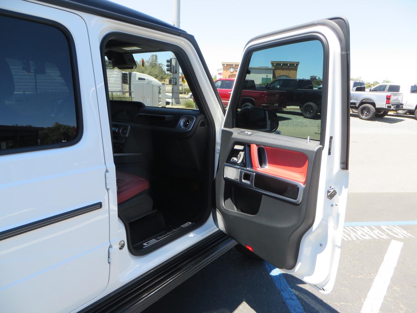 2021 White /Red Mercedes-Benz G-Class G 550 (W1NYC6BJ1MX) with an 4.0L V8 engine, automatic transmission, located at 2630 Grass Valley Highway, Auburn, CA, 95603, (530) 508-5100, 38.937893, -121.095482 - Features Vossen Wheels and Toyo AT3 tires. Also has the stock wheels and tires as well. - Photo#36