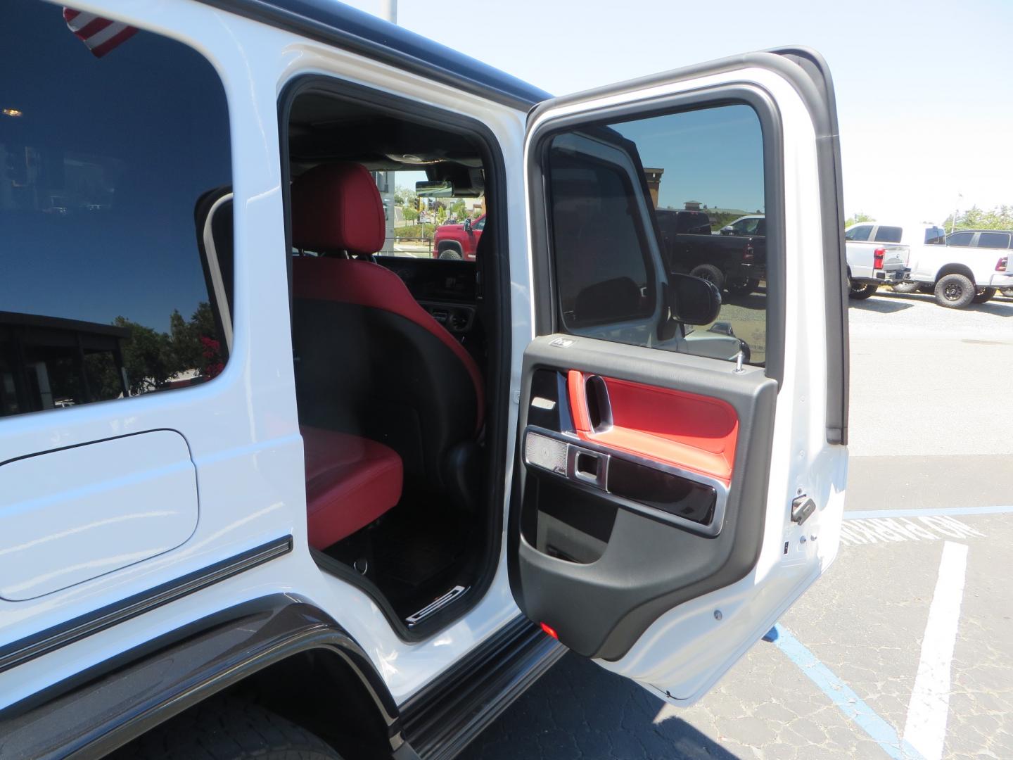 2021 White /Red Mercedes-Benz G-Class G 550 (W1NYC6BJ1MX) with an 4.0L V8 engine, automatic transmission, located at 2630 Grass Valley Highway, Auburn, CA, 95603, (530) 508-5100, 38.937893, -121.095482 - Features Vossen Wheels and Toyo AT3 tires. Also has the stock wheels and tires as well. - Photo#43