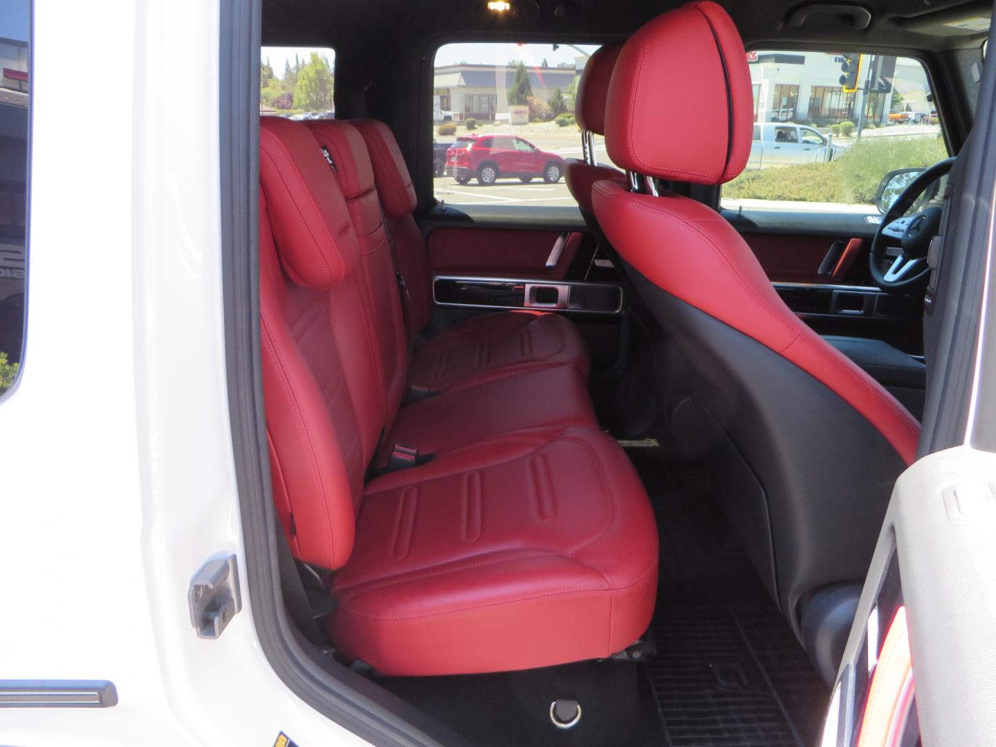 2021 White /Red Mercedes-Benz G-Class G 550 (W1NYC6BJ1MX) with an 4.0L V8 engine, automatic transmission, located at 2630 Grass Valley Highway, Auburn, CA, 95603, (530) 508-5100, 38.937893, -121.095482 - Features Vossen Wheels and Toyo AT3 tires. Also has the stock wheels and tires as well. - Photo#46