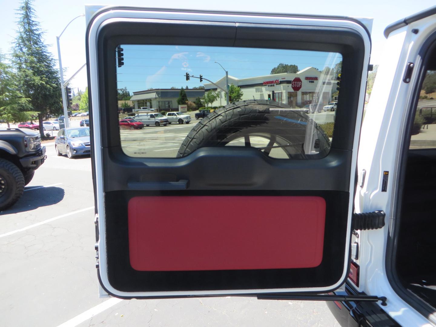 2021 White /Red Mercedes-Benz G-Class G 550 (W1NYC6BJ1MX) with an 4.0L V8 engine, automatic transmission, located at 2630 Grass Valley Highway, Auburn, CA, 95603, (530) 508-5100, 38.937893, -121.095482 - Features Vossen Wheels and Toyo AT3 tires. Also has the stock wheels and tires as well. - Photo#52