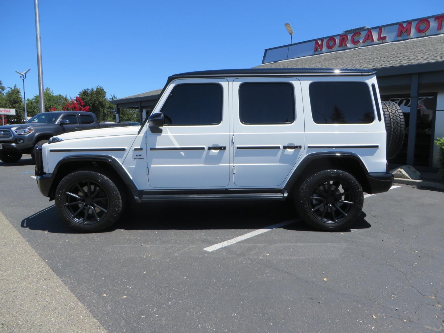 2021 White /Red Mercedes-Benz G-Class G 550 (W1NYC6BJ1MX) with an 4.0L V8 engine, automatic transmission, located at 2630 Grass Valley Highway, Auburn, CA, 95603, (530) 508-5100, 38.937893, -121.095482 - Features Vossen Wheels and Toyo AT3 tires. Also has the stock wheels and tires as well. - Photo#7