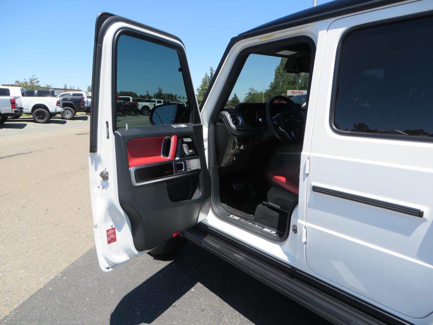 2021 White /Red Mercedes-Benz G-Class G 550 (W1NYC6BJ1MX) with an 4.0L V8 engine, automatic transmission, located at 2630 Grass Valley Highway, Auburn, CA, 95603, (530) 508-5100, 38.937893, -121.095482 - Features Vossen Wheels and Toyo AT3 tires. Also has the stock wheels and tires as well. - Photo#12