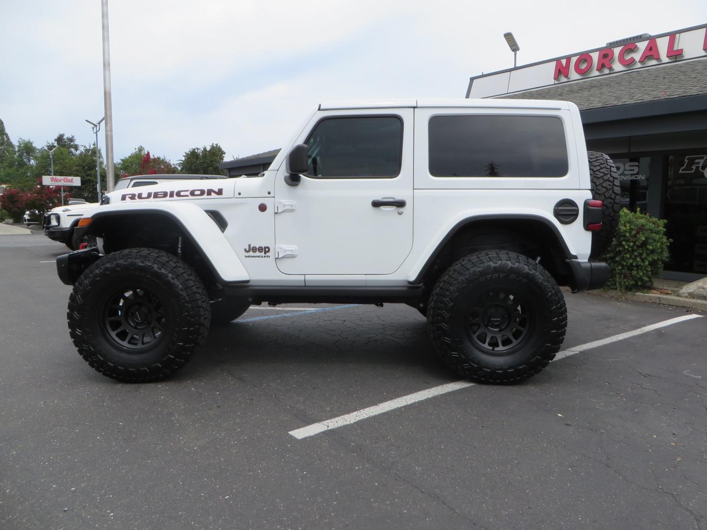 2021 White /Black Jeep Wrangler Rubicon (1C4HJXCG0MW) with an 3.6L V6 engine, Manual 6 speed transmission, located at 2630 Grass Valley Highway, Auburn, CA, 95603, (530) 508-5100, 38.937893, -121.095482 - 2 Door lifted Rubicon featuring a 3" Zone Offroad lift kit, Fox Adventure series shocks, 17" Method wheels, 37" Toyo RT Trail tires, Teraflex Spare tire carrier, and window tint. - Photo#6