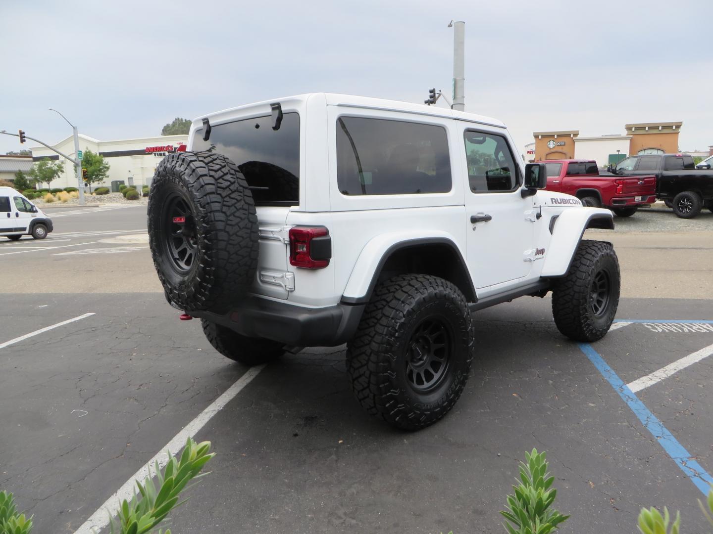 2021 White /Black Jeep Wrangler Rubicon (1C4HJXCG0MW) with an 3.6L V6 engine, Manual 6 speed transmission, located at 2630 Grass Valley Highway, Auburn, CA, 95603, (530) 508-5100, 38.937893, -121.095482 - 2 Door lifted Rubicon featuring a 3" Zone Offroad lift kit, Fox Adventure series shocks, 17" Method wheels, 37" Toyo RT Trail tires, Teraflex Spare tire carrier, and window tint. - Photo#4