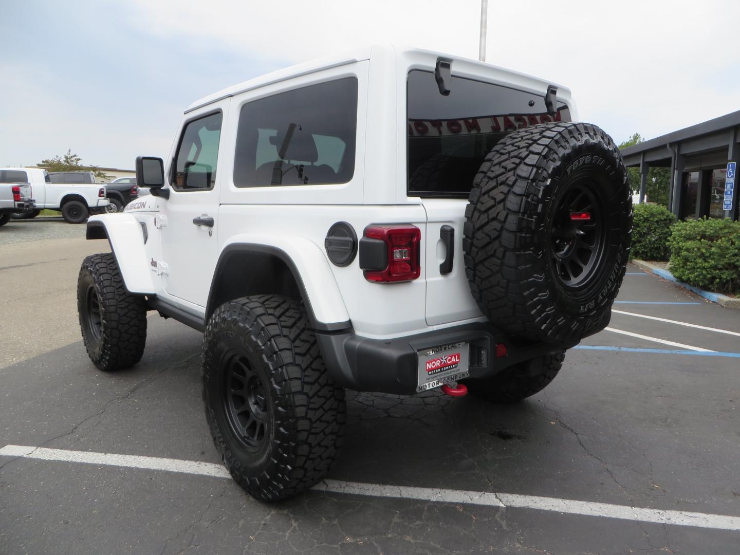 2021 White /Black Jeep Wrangler Rubicon (1C4HJXCG0MW) with an 3.6L V6 engine, Manual 6 speed transmission, located at 2630 Grass Valley Highway, Auburn, CA, 95603, (530) 508-5100, 38.937893, -121.095482 - 2 Door lifted Rubicon featuring a 3" Zone Offroad lift kit, Fox Adventure series shocks, 17" Method wheels, 37" Toyo RT Trail tires, Teraflex Spare tire carrier, and window tint. - Photo#5