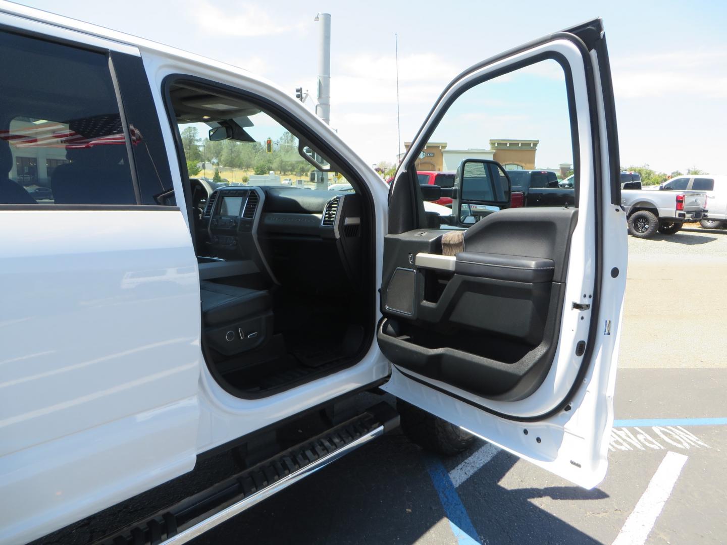 2017 White Ford F-250 SD Lariat Crew Cab Short Bed 4WD (1FT7W2BT4HE) with an 6.7L V8 OHV 16V DIESEL engine, 6A transmission, located at 2630 Grass Valley Highway, Auburn, CA, 95603, (530) 508-5100, 38.937893, -121.095482 - Leveled F250 sitting on brand new 17" Method Race wheels and Nitto Recon Grappler tires. - Photo#41