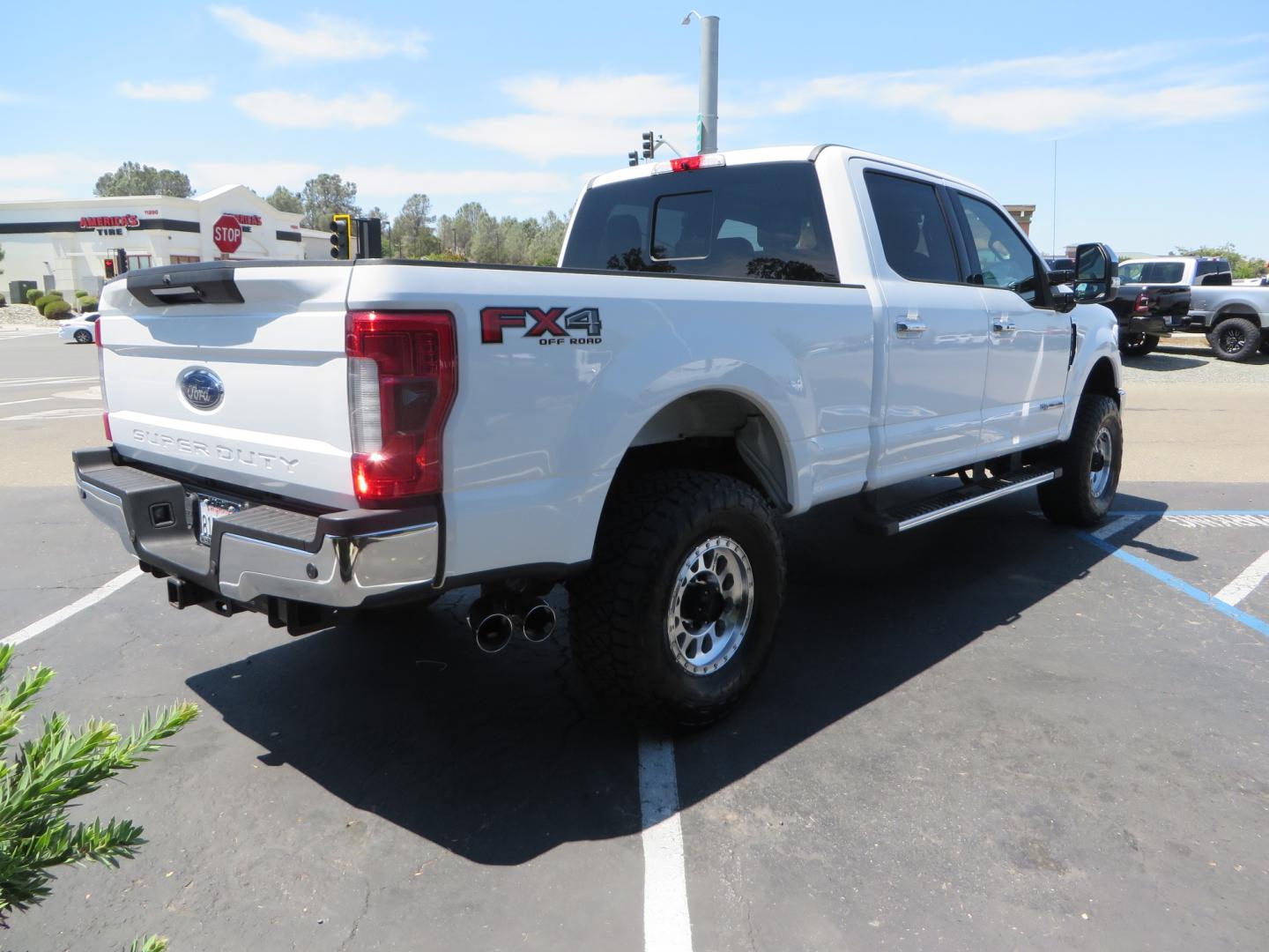 2017 White Ford F-250 SD Lariat Crew Cab Short Bed 4WD (1FT7W2BT4HE) with an 6.7L V8 OHV 16V DIESEL engine, 6A transmission, located at 2630 Grass Valley Highway, Auburn, CA, 95603, (530) 508-5100, 38.937893, -121.095482 - Leveled F250 sitting on brand new 17" Method Race wheels and Nitto Recon Grappler tires. - Photo#4