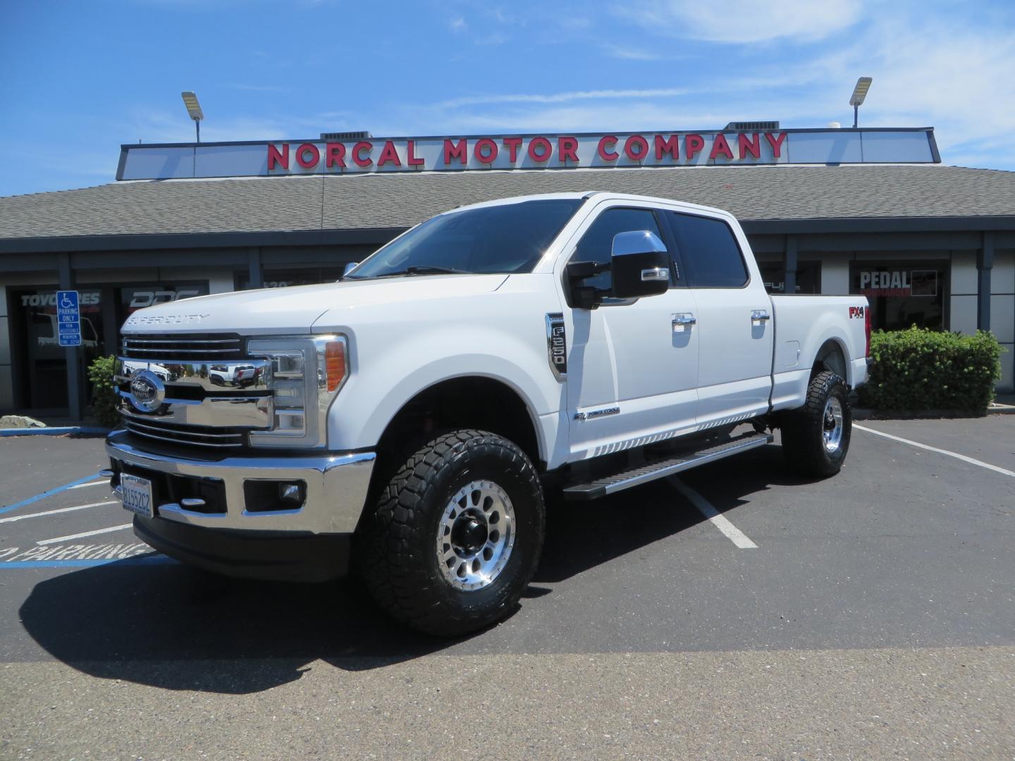 2017 White Ford F-250 SD Lariat Crew Cab Short Bed 4WD (1FT7W2BT4HE) with an 6.7L V8 OHV 16V DIESEL engine, 6A transmission, located at 2630 Grass Valley Highway, Auburn, CA, 95603, (530) 508-5100, 38.937893, -121.095482 - Leveled F250 sitting on brand new 17" Method Race wheels and Nitto Recon Grappler tires. - Photo#0