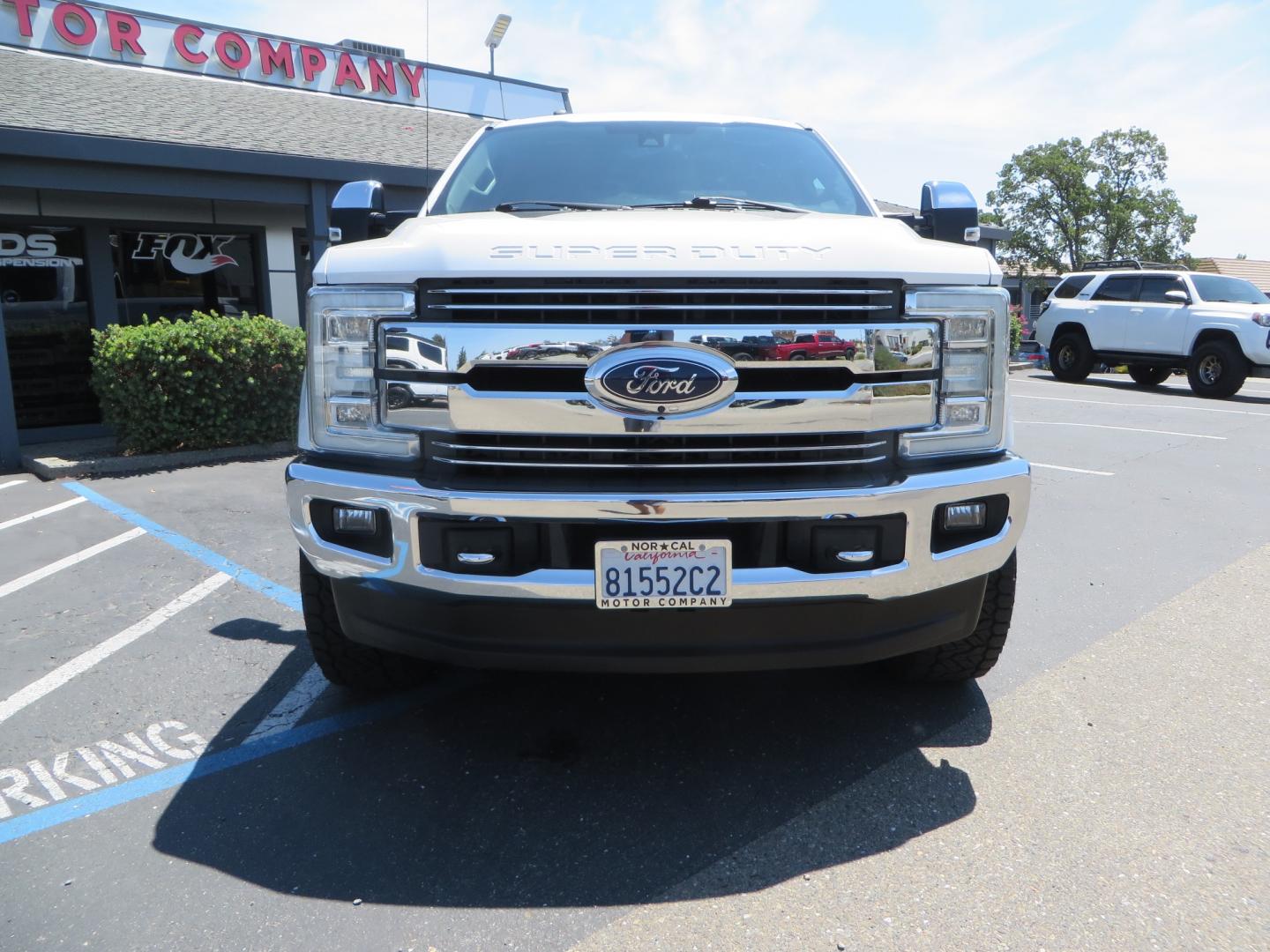 2017 White Ford F-250 SD Lariat Crew Cab Short Bed 4WD (1FT7W2BT4HE) with an 6.7L V8 OHV 16V DIESEL engine, 6A transmission, located at 2630 Grass Valley Highway, Auburn, CA, 95603, (530) 508-5100, 38.937893, -121.095482 - Leveled F250 sitting on brand new 17" Method Race wheels and Nitto Recon Grappler tires. - Photo#1