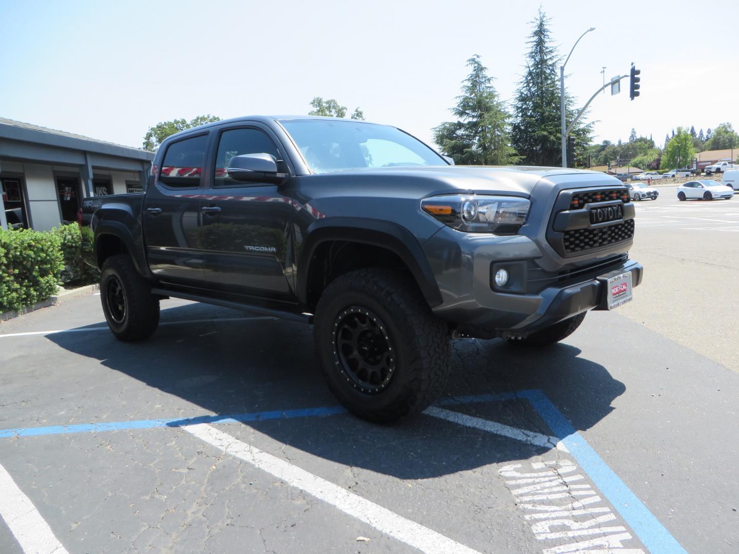 2017 CHARCOAL /GREY Toyota Tacoma TRD Off-Road Double Cab Short Bed V6 6AT 4WD (3TMCZ5AN6HM) with an 3.6L V6 DOHC 24V engine, 6A transmission, located at 2630 Grass Valley Highway, Auburn, CA, 95603, (530) 508-5100, 38.937893, -121.095482 - Features- Method Race wheels, BFG KO2 tires, Rocksliders, Bedmat, and Magnaflow exhaust. - Photo#2