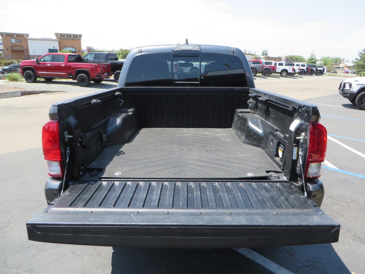 2017 CHARCOAL /GREY Toyota Tacoma TRD Off-Road Double Cab Short Bed V6 6AT 4WD (3TMCZ5AN6HM) with an 3.6L V6 DOHC 24V engine, 6A transmission, located at 2630 Grass Valley Highway, Auburn, CA, 95603, (530) 508-5100, 38.937893, -121.095482 - Features- Method Race wheels, BFG KO2 tires, Rocksliders, Bedmat, and Magnaflow exhaust. - Photo#10