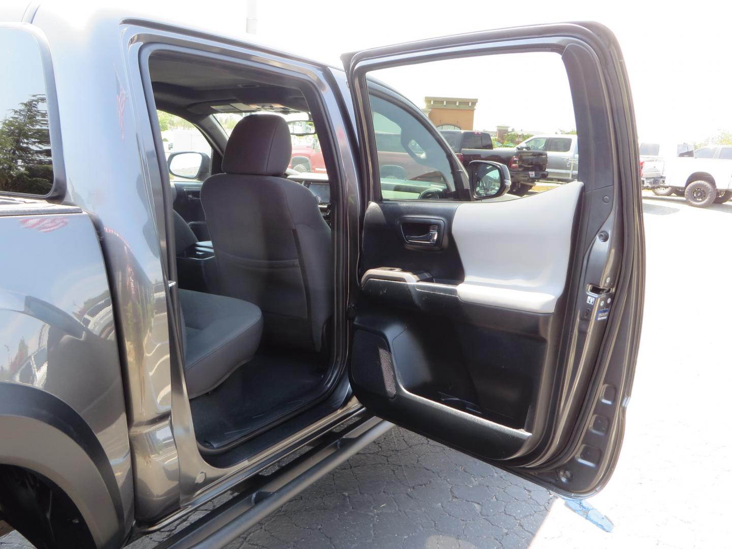 2017 CHARCOAL /GREY Toyota Tacoma TRD Off-Road Double Cab Short Bed V6 6AT 4WD (3TMCZ5AN6HM) with an 3.6L V6 DOHC 24V engine, 6A transmission, located at 2630 Grass Valley Highway, Auburn, CA, 95603, (530) 508-5100, 38.937893, -121.095482 - Features- Method Race wheels, BFG KO2 tires, Rocksliders, Bedmat, and Magnaflow exhaust. - Photo#43