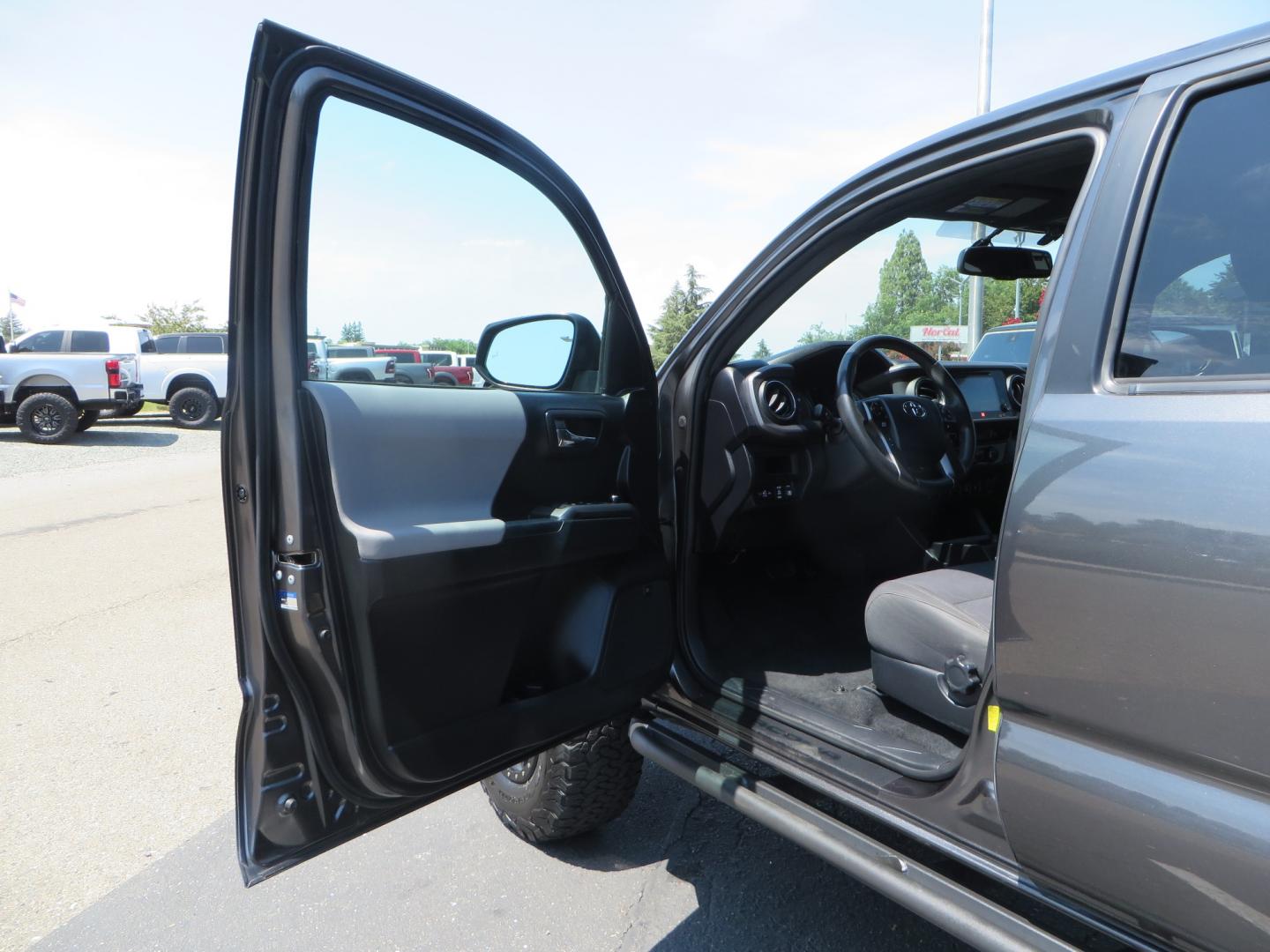 2017 CHARCOAL /GREY Toyota Tacoma TRD Off-Road Double Cab Short Bed V6 6AT 4WD (3TMCZ5AN6HM) with an 3.6L V6 DOHC 24V engine, 6A transmission, located at 2630 Grass Valley Highway, Auburn, CA, 95603, (530) 508-5100, 38.937893, -121.095482 - Features- Method Race wheels, BFG KO2 tires, Rocksliders, Bedmat, and Magnaflow exhaust. - Photo#12