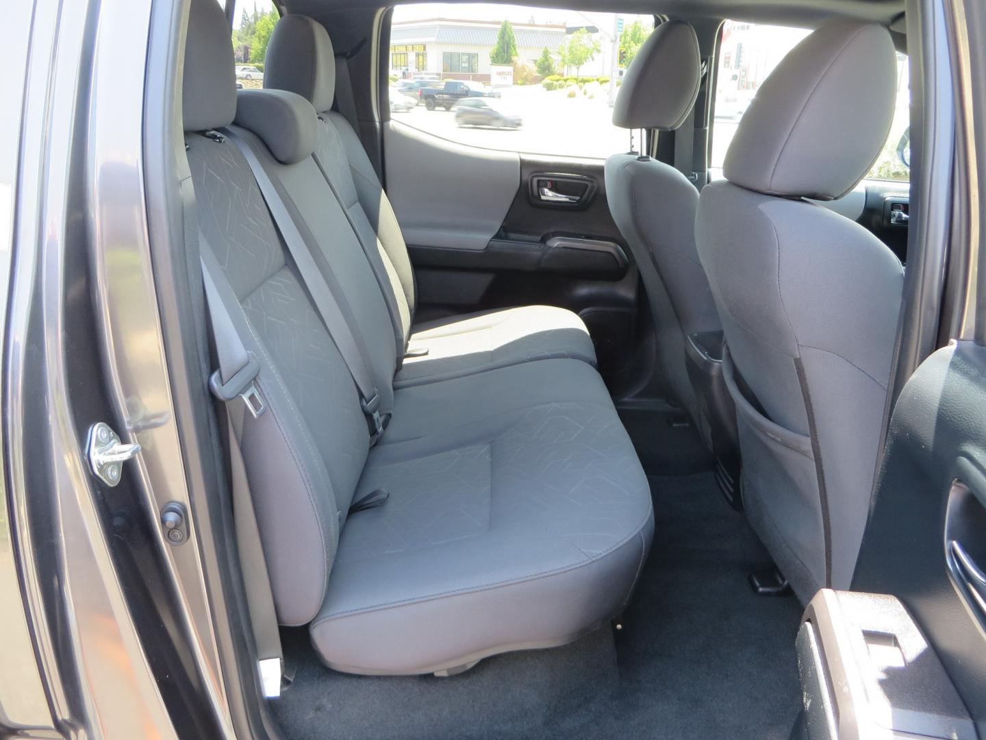 2017 CHARCOAL /GREY Toyota Tacoma TRD Off-Road Double Cab Short Bed V6 6AT 4WD (3TMCZ5AN6HM) with an 3.6L V6 DOHC 24V engine, 6A transmission, located at 2630 Grass Valley Highway, Auburn, CA, 95603, (530) 508-5100, 38.937893, -121.095482 - Features- Method Race wheels, BFG KO2 tires, Rocksliders, Bedmat, and Magnaflow exhaust. - Photo#46