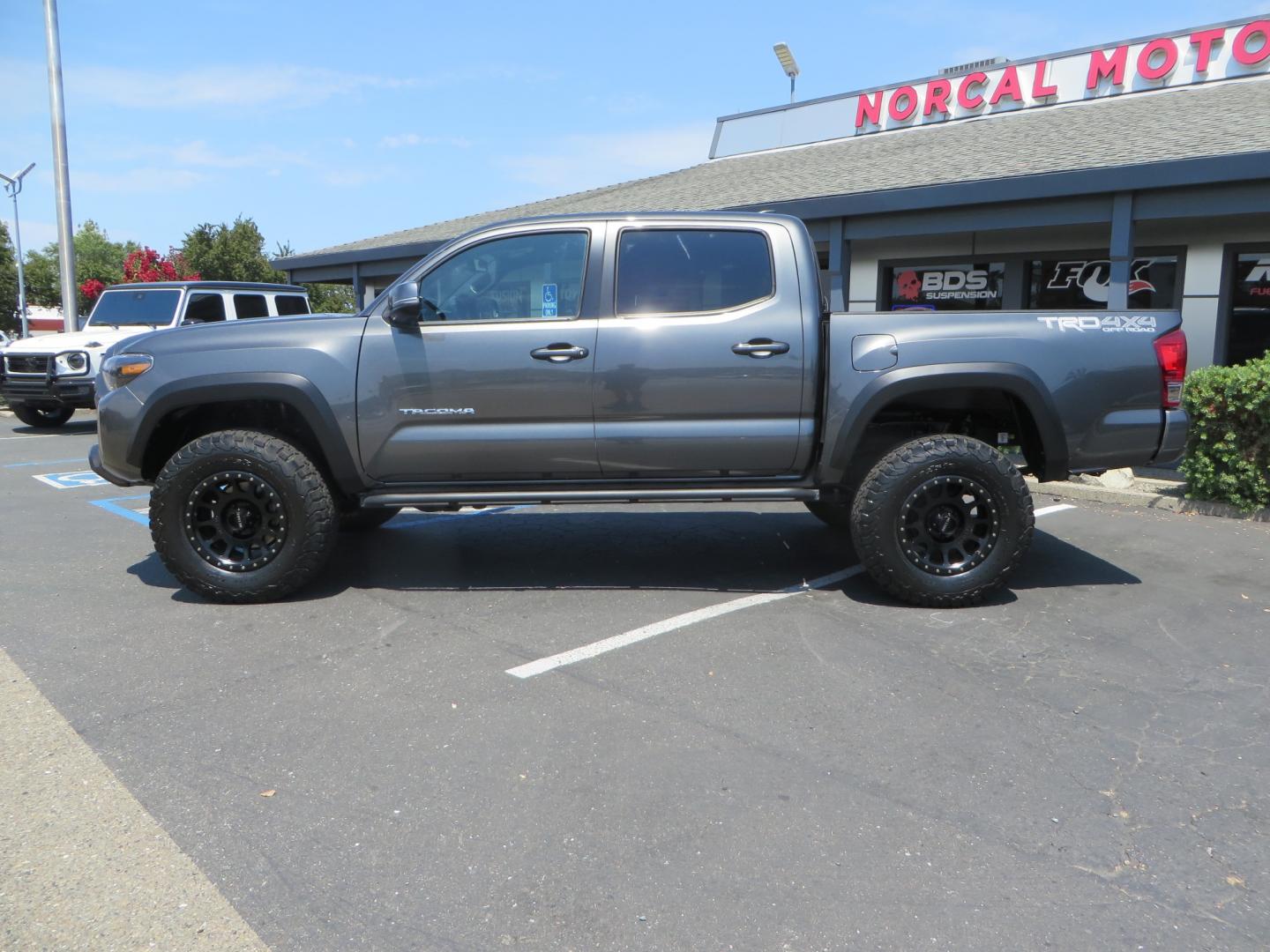 2017 CHARCOAL /GREY Toyota Tacoma TRD Off-Road Double Cab Short Bed V6 6AT 4WD (3TMCZ5AN6HM) with an 3.6L V6 DOHC 24V engine, 6A transmission, located at 2630 Grass Valley Highway, Auburn, CA, 95603, (530) 508-5100, 38.937893, -121.095482 - Features- Method Race wheels, BFG KO2 tires, Rocksliders, Bedmat, and Magnaflow exhaust. - Photo#7