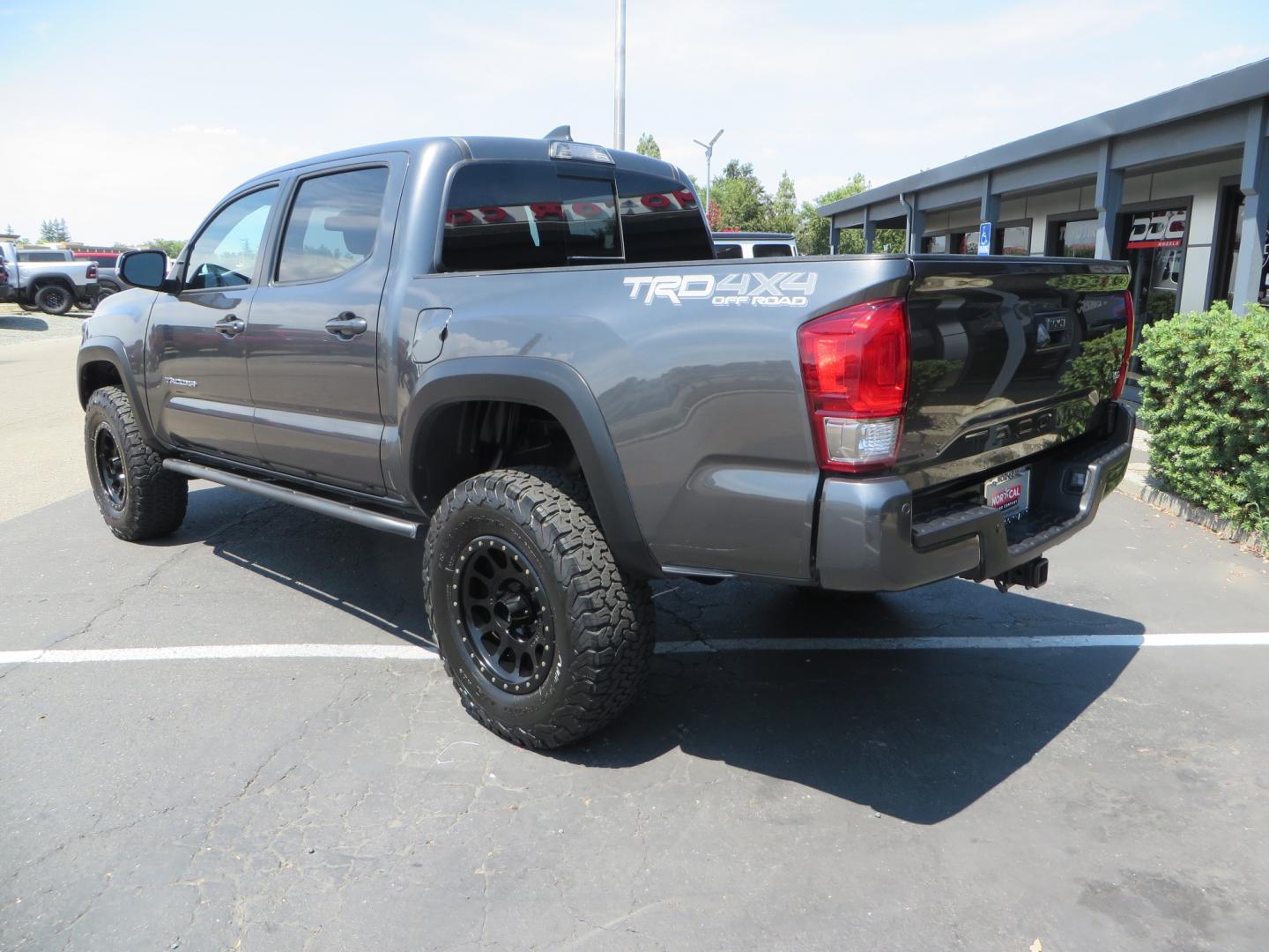 2017 CHARCOAL /GREY Toyota Tacoma TRD Off-Road Double Cab Short Bed V6 6AT 4WD (3TMCZ5AN6HM) with an 3.6L V6 DOHC 24V engine, 6A transmission, located at 2630 Grass Valley Highway, Auburn, CA, 95603, (530) 508-5100, 38.937893, -121.095482 - Features- Method Race wheels, BFG KO2 tires, Rocksliders, Bedmat, and Magnaflow exhaust. - Photo#6