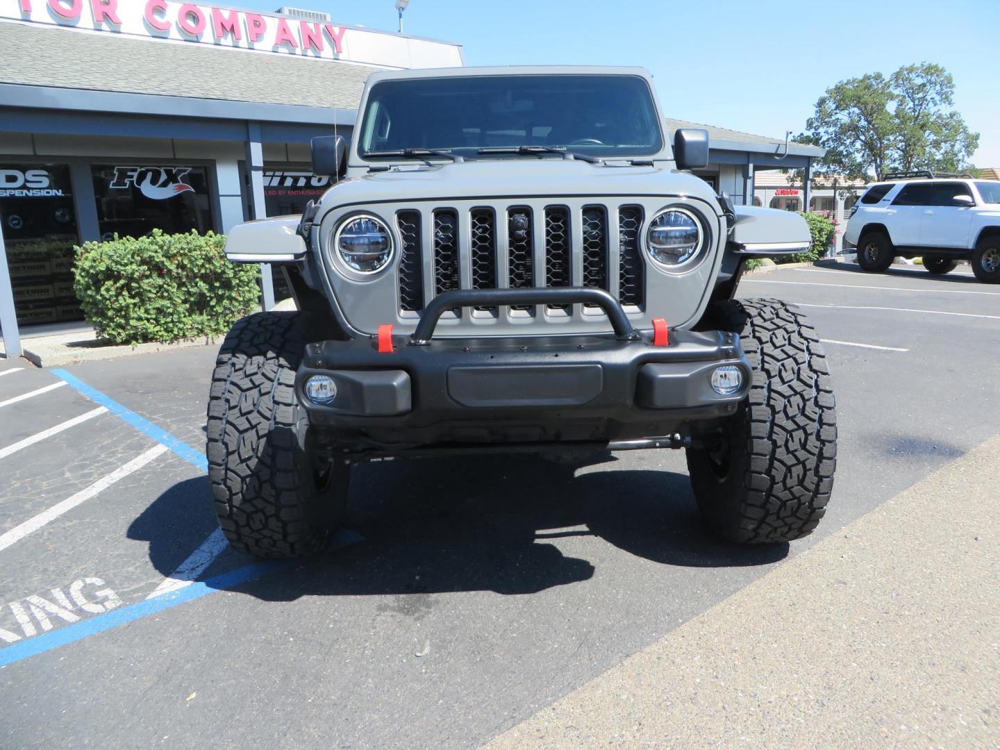 2021 Sting Grey /BLACK Jeep Gladiator Rubicon (1C6JJTBM1ML) with an 3.6L V6 DOHC 24V engine, 6M transmission, located at 2630 Grass Valley Highway, Auburn, CA, 95603, (530) 508-5100, 38.937893, -121.095482 - Features- EVO MFG 4.5" suspension system, 17" Method Race wheels, 37" Toyo AT3 tires, Fabfours running boards, Weathertech bedmat, Bolt on front pre runner bar, and window tint. - Photo#2