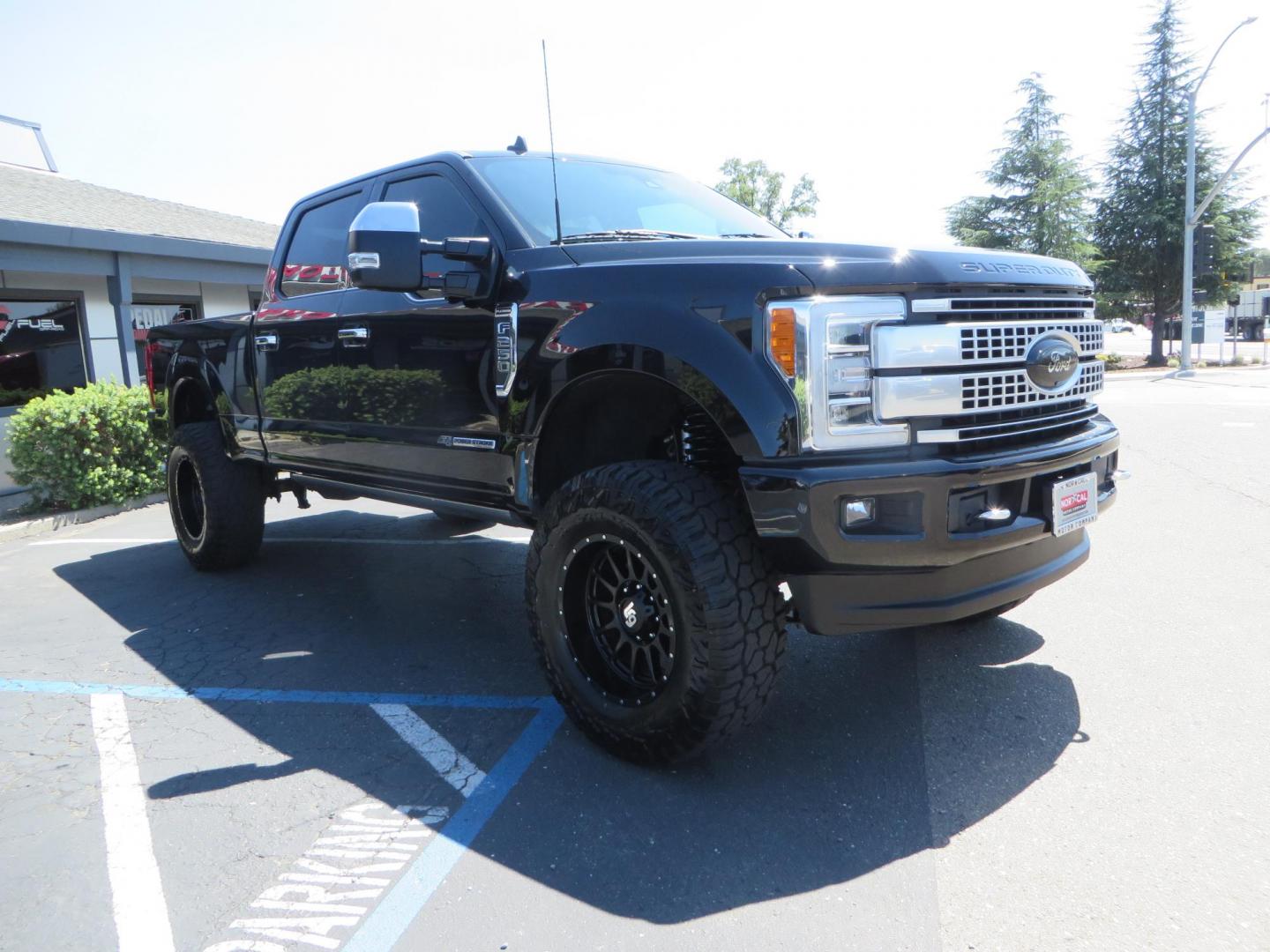 2019 BLACK Ford F-250 SD Platinum Crew Cab Short Bed 4WD (1FT7W2BTXKE) with an 6.7L V8 OHV 16V DIESEL engine, 6A transmission, located at 2630 Grass Valley Highway, Auburn, CA, 95603, (530) 508-5100, 38.937893, -121.095482 - Featuring a 6" Pro Comp Suspension system, Fox shocks and dual steering stabilizers, 38" Falken Wildpeak tires, 20" LRG wheels, Window tint, and painted Ford badges. - Photo#1