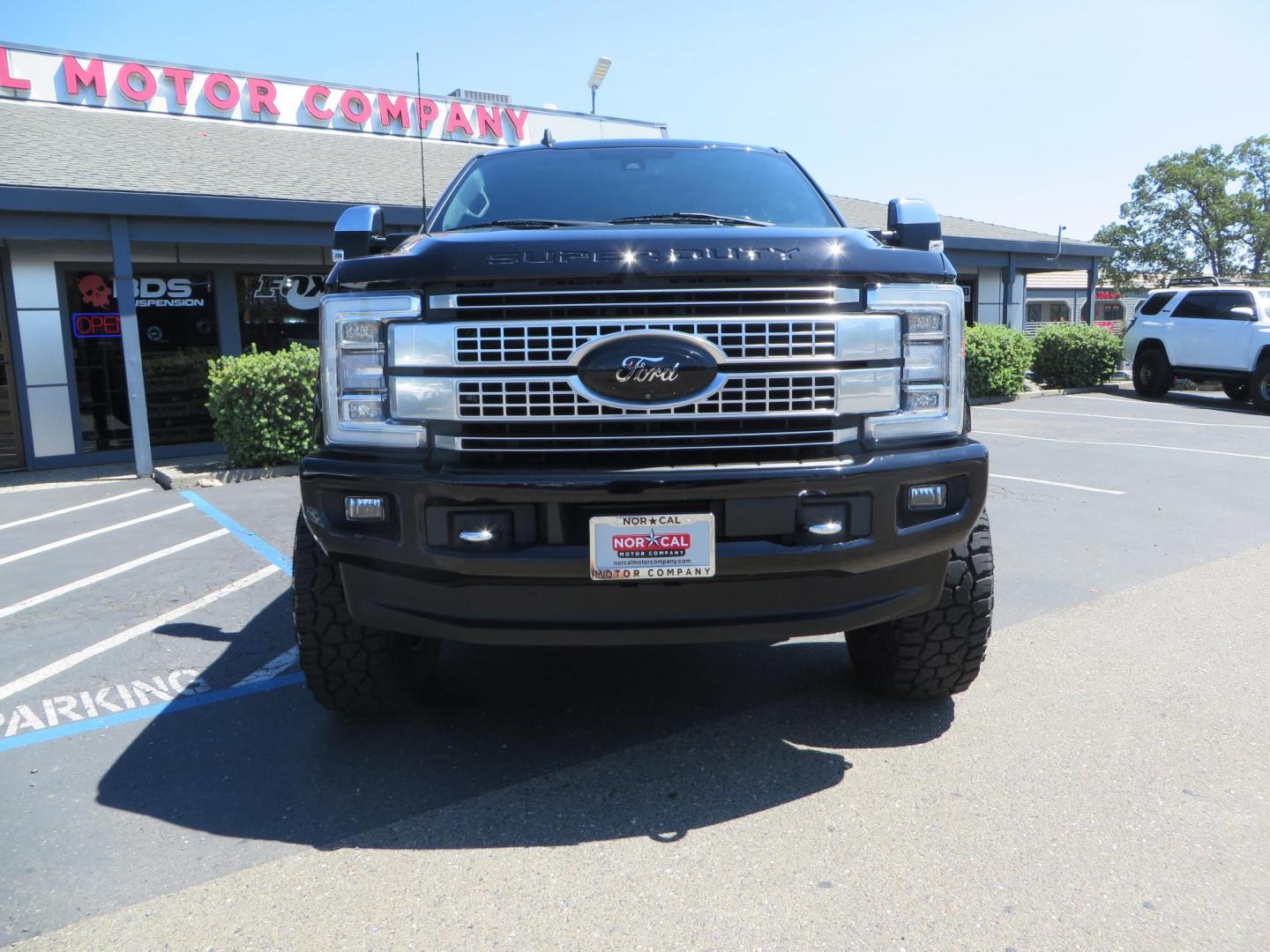 2019 BLACK Ford F-250 SD Platinum Crew Cab Short Bed 4WD (1FT7W2BTXKE) with an 6.7L V8 OHV 16V DIESEL engine, 6A transmission, located at 2630 Grass Valley Highway, Auburn, CA, 95603, (530) 508-5100, 38.937893, -121.095482 - Featuring a 6" Pro Comp Suspension system, Fox shocks and dual steering stabilizers, 38" Falken Wildpeak tires, 20" LRG wheels, Window tint, and painted Ford badges. - Photo#3