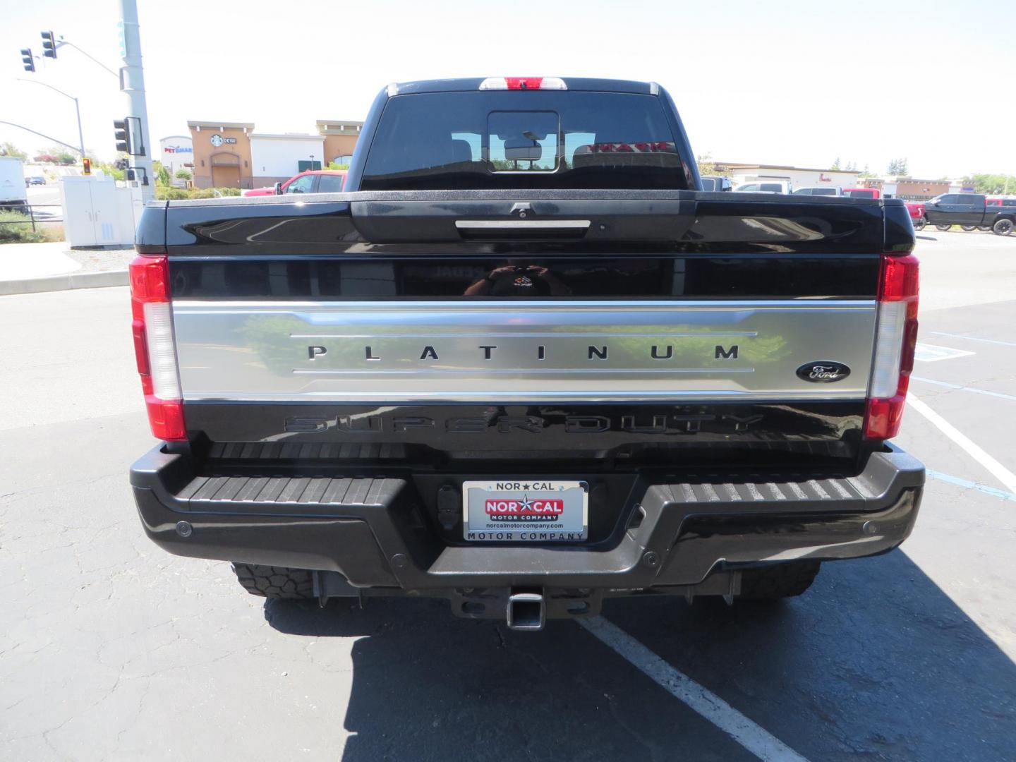 2019 BLACK Ford F-250 SD Platinum Crew Cab Short Bed 4WD (1FT7W2BTXKE) with an 6.7L V8 OHV 16V DIESEL engine, 6A transmission, located at 2630 Grass Valley Highway, Auburn, CA, 95603, (530) 508-5100, 38.937893, -121.095482 - Featuring a 6" Pro Comp Suspension system, Fox shocks and dual steering stabilizers, 38" Falken Wildpeak tires, 20" LRG wheels, Window tint, and painted Ford badges. - Photo#5