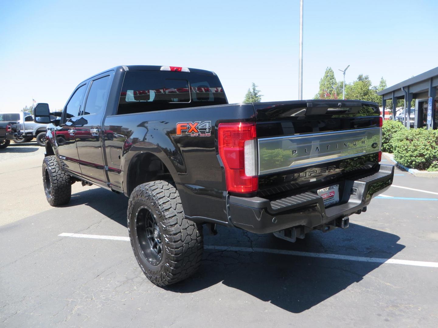 2019 BLACK Ford F-250 SD Platinum Crew Cab Short Bed 4WD (1FT7W2BTXKE) with an 6.7L V8 OHV 16V DIESEL engine, 6A transmission, located at 2630 Grass Valley Highway, Auburn, CA, 95603, (530) 508-5100, 38.937893, -121.095482 - Featuring a 6" Pro Comp Suspension system, Fox shocks and dual steering stabilizers, 38" Falken Wildpeak tires, 20" LRG wheels, Window tint, and painted Ford badges. - Photo#6